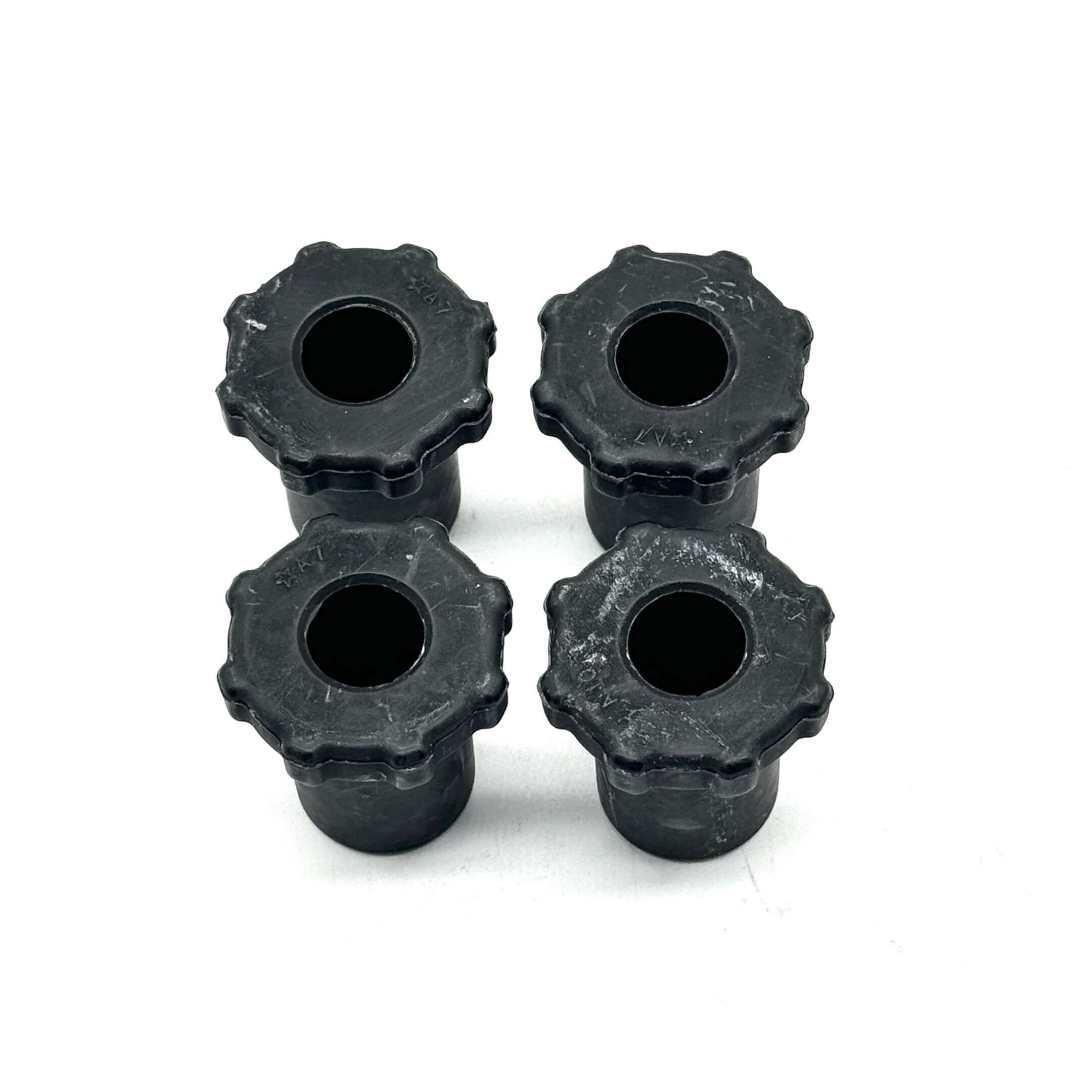 Rear leaf spring top bushings for Honda Acty Truck HA6, HA7 models (1999-2009) - close-up view of genuine Honda bushings in a set of four, designed for rear leaf spring suspension