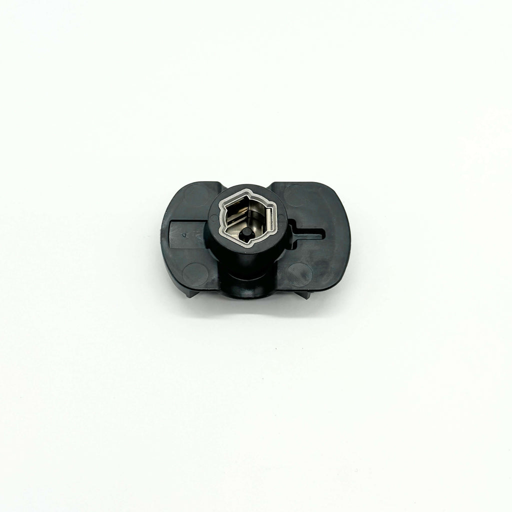 Bottom view of distributor rotor compatible with Suzuki Carry Truck DC51T, DD51T from 1991 to 1998, featuring unique star-shaped metal rotor inside black polymer body - precision-engineered for exact fitment and reliable conductivity.