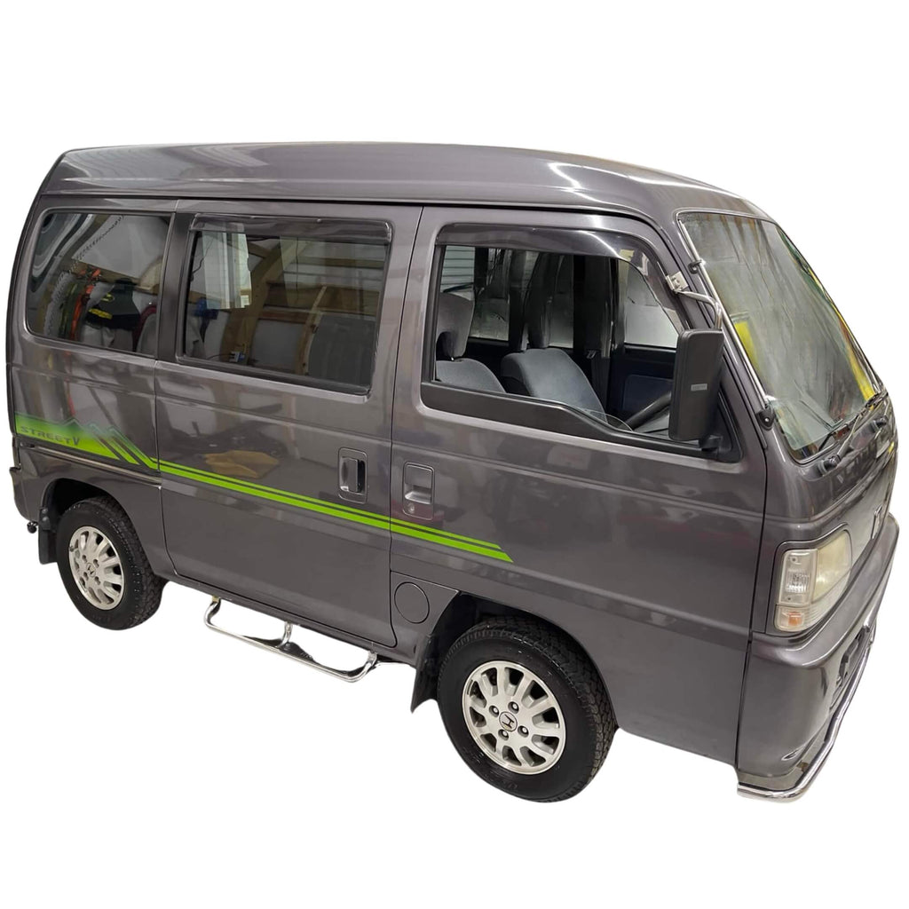 Full side profile of Honda Street Van HH4 with a detailed view of the green Street V side decal, reflecting the unique style of 1990s Japanese kei vans