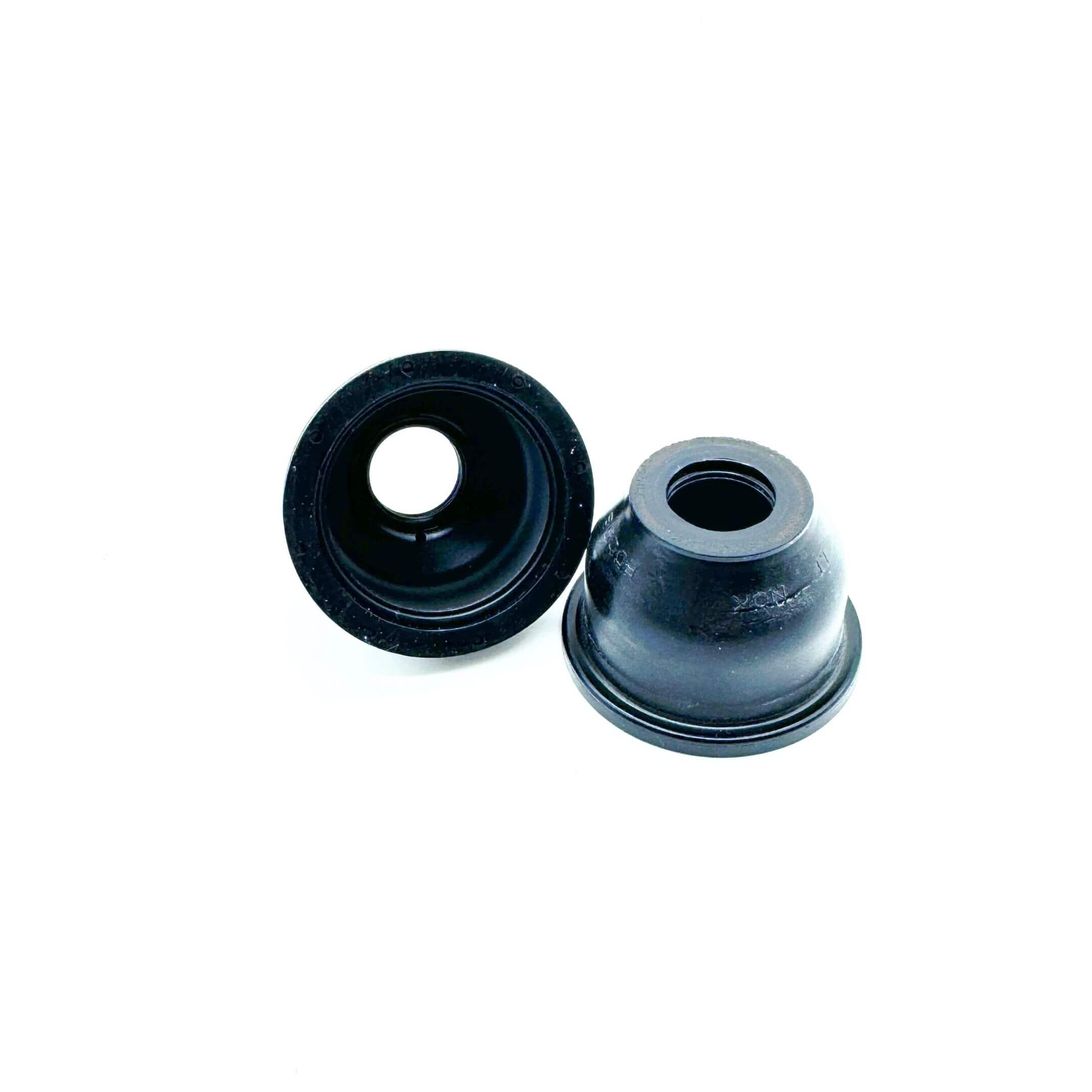 Angled view of the Center Steering Link Ball Joint Boot Set for Honda Acty Truck HA3, HA4 (1990-1999), showing the protective design of the rubber boots.