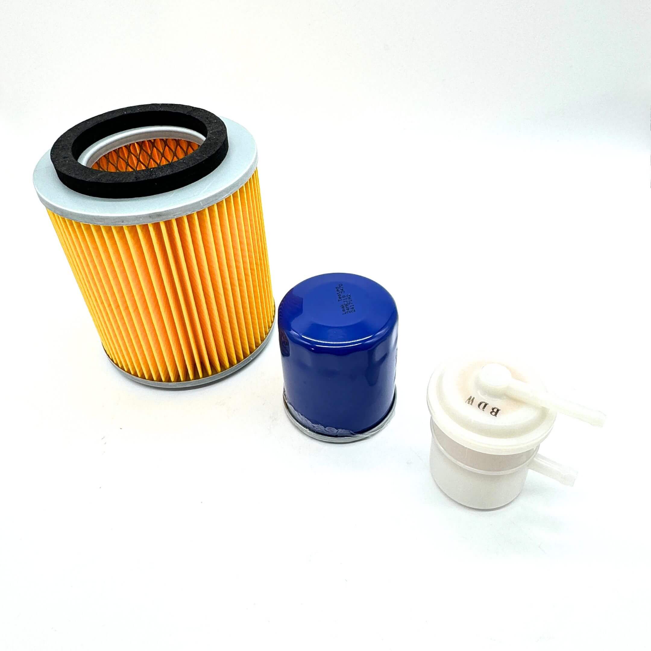 3 Piece Filter Kit for Suzuki Carry Truck DC51T, DD51T Models (1991-1998), featuring the Short 5" Air Filter, Oil Filter, and Fuel Filter arranged side by side, showcasing essential components for complete engine maintenance.