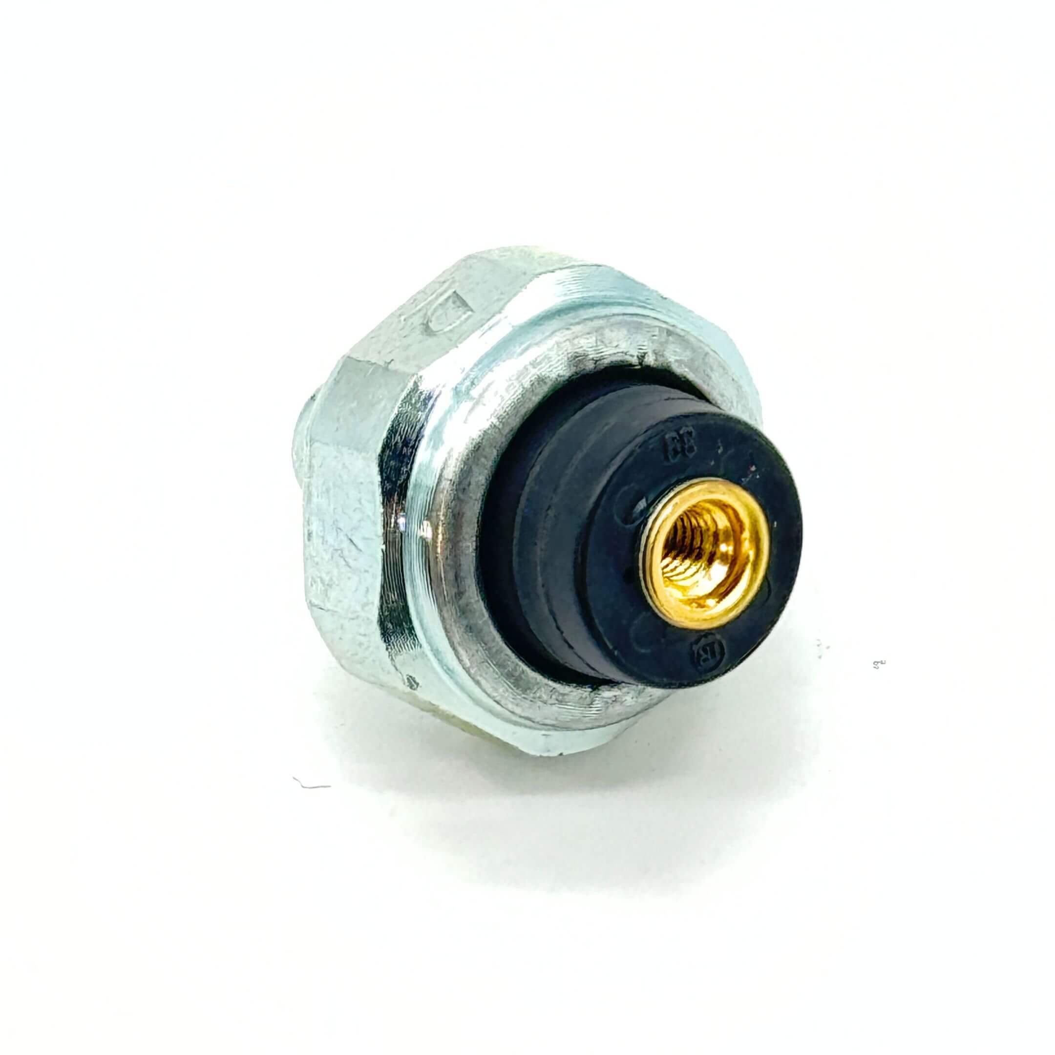 Angled view of Oil Pressure Switch with visible brass fitting for Honda Acty Truck (1990-1999).