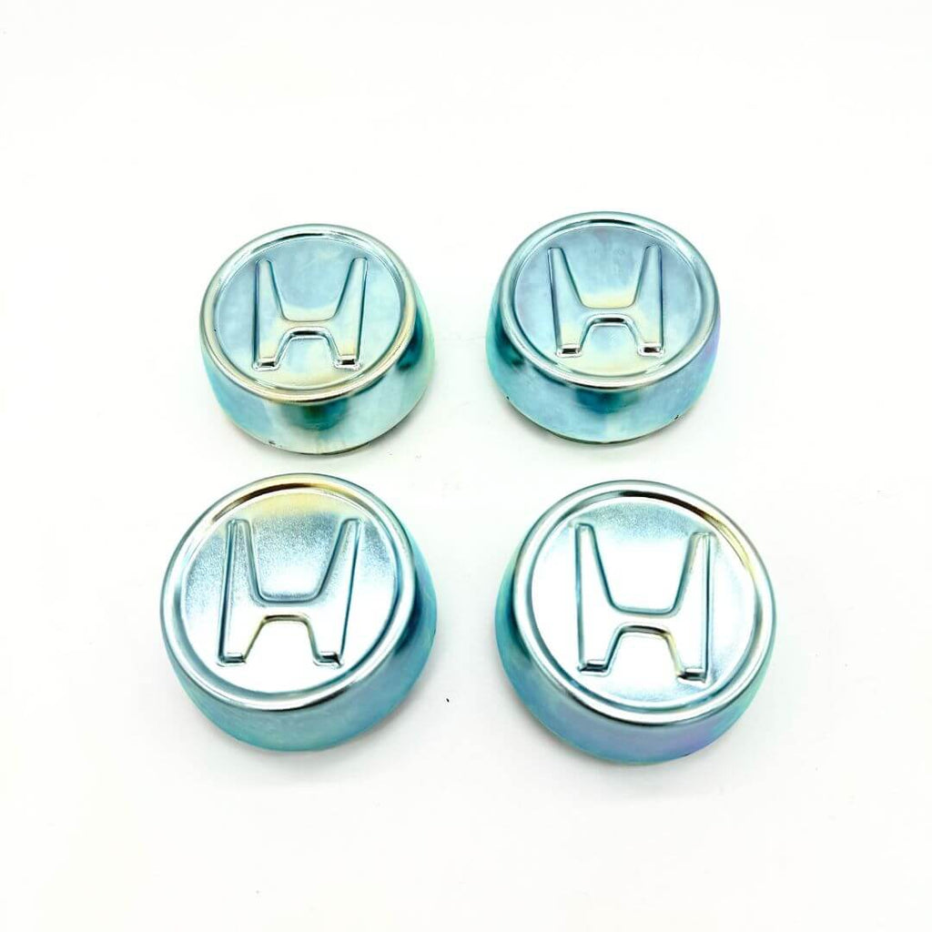 Honda Acty Truck Wheel Center Cap Set (1990-1999): Durable metal caps designed to fit securely onto HA3 and HA4 model wheels, adding a sleek aesthetic and brand recognition with a polished 'H' logo on each cap.