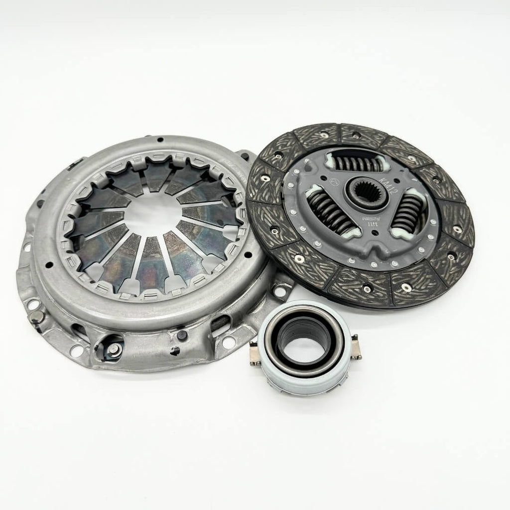 Complete 3-piece clutch replacement kit for Subaru Sambar KS3, KS4 models from 1990-1998, featuring clutch disc, pressure plate, and release bearing, ready to install from Oiwa Garage.