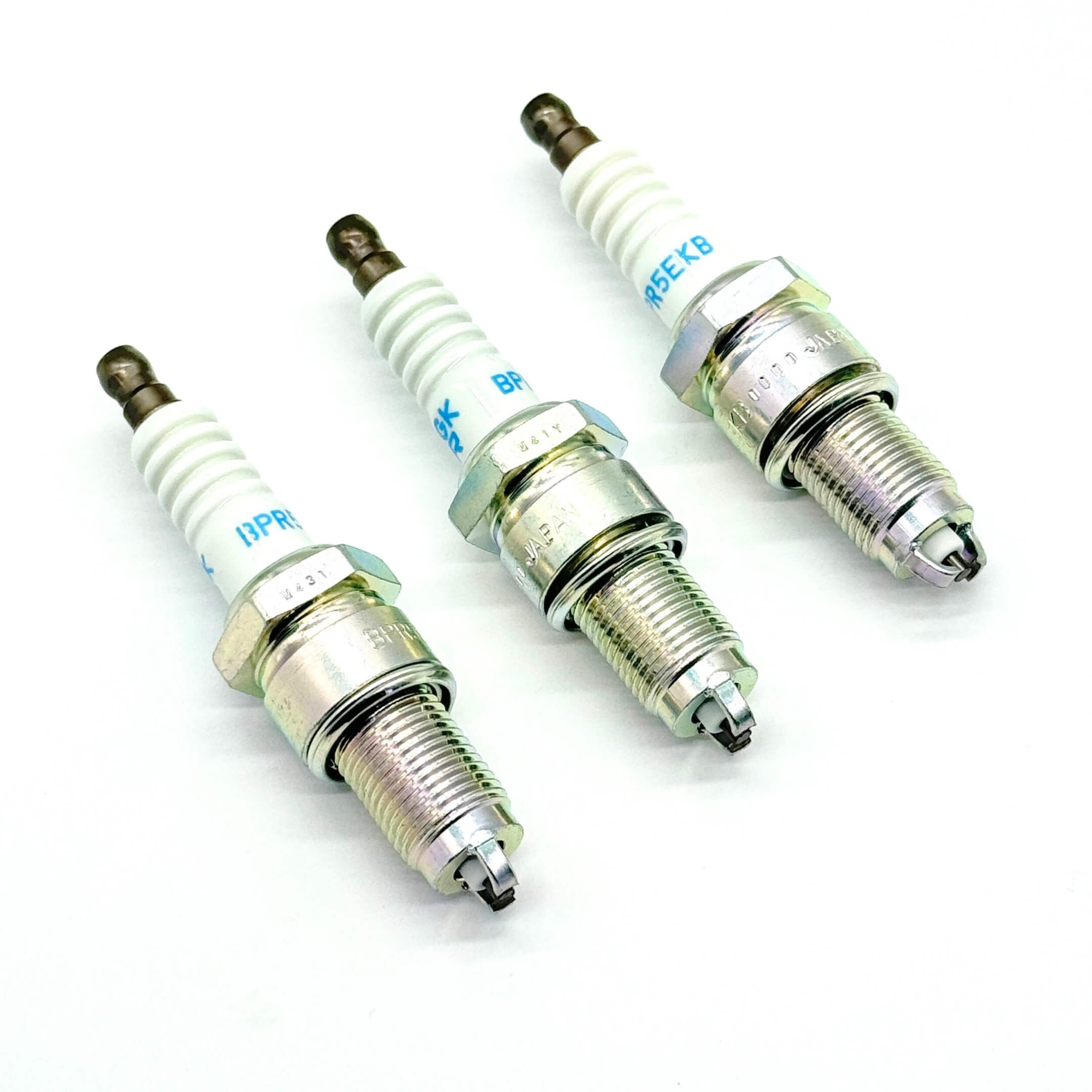 Close-up of precision-engineered spark plugs for Daihatsu Hijet S110P models, ensuring consistent combustion and enhanced engine performance.