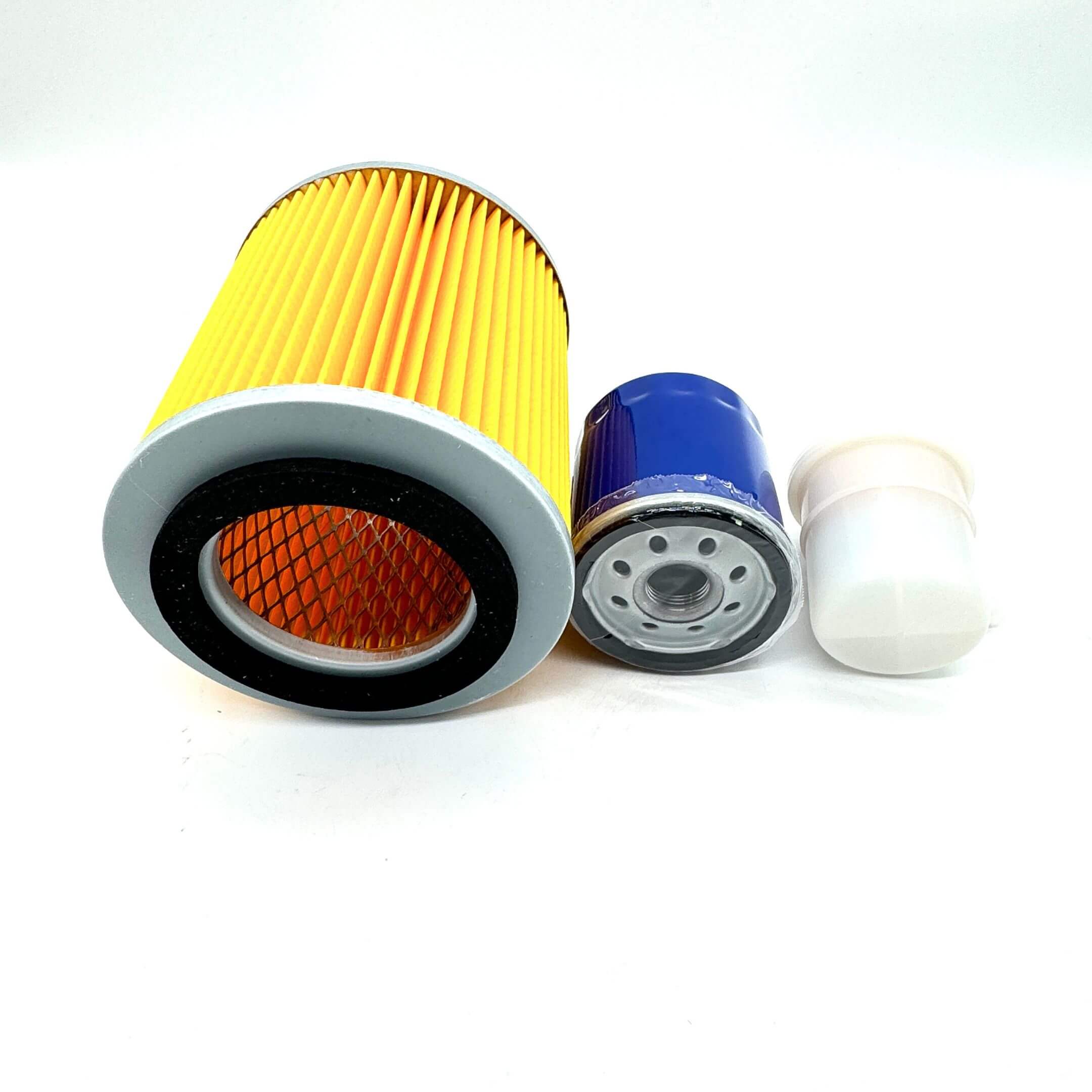 Close-up of the 3 Piece Filter Kit including Short 5" Air Filter, Oil Filter, and Fuel Filter for Suzuki Carry Truck DC51T, DD51T Models (1991-1998), highlighting the top and bottom views of each filter for detailed inspection.