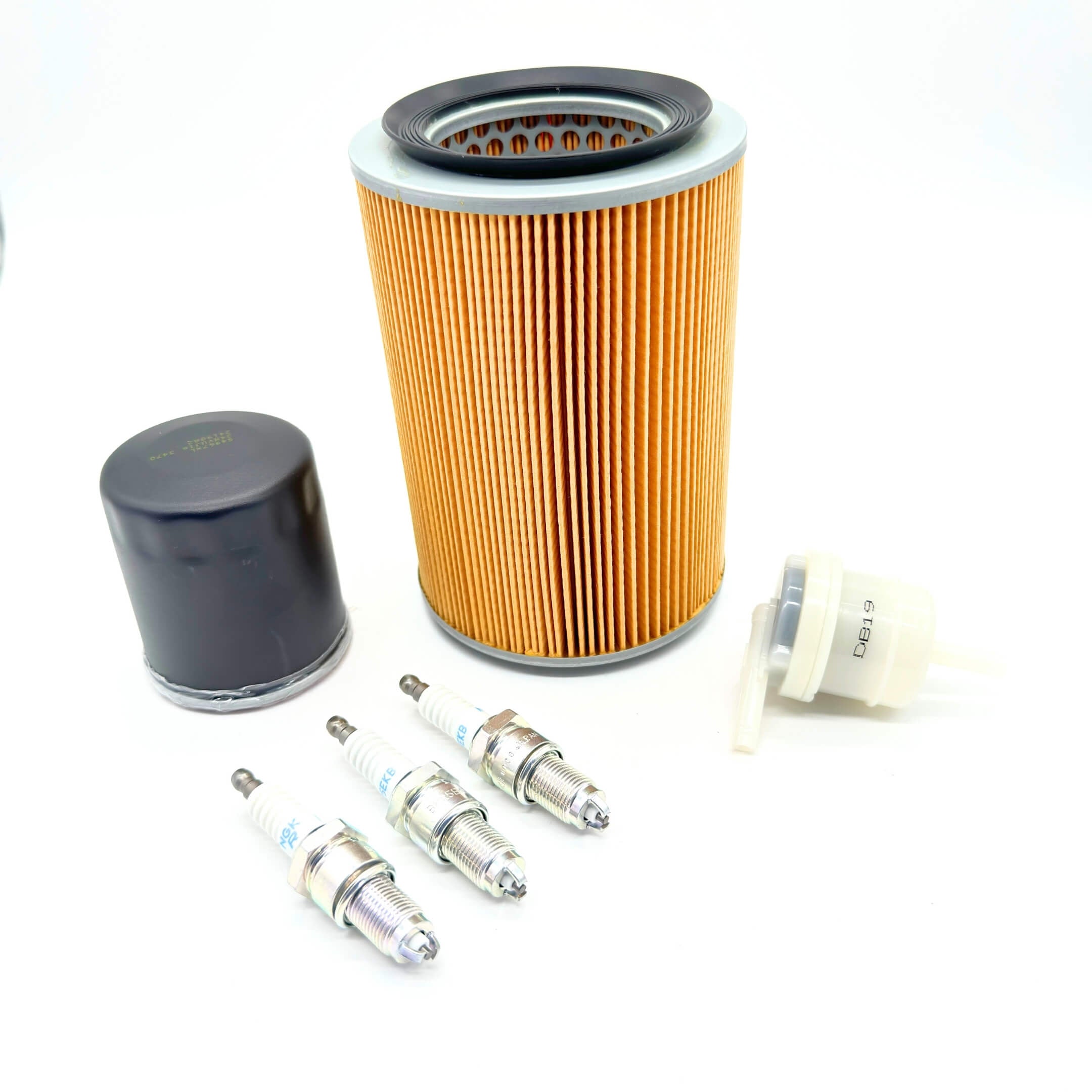 Daihatsu Hijet 6 Piece Tune-Up Kit S110P - Close-up of Air Filter, Oil Filter, Fuel Filter, and 3 Spark Plugs.