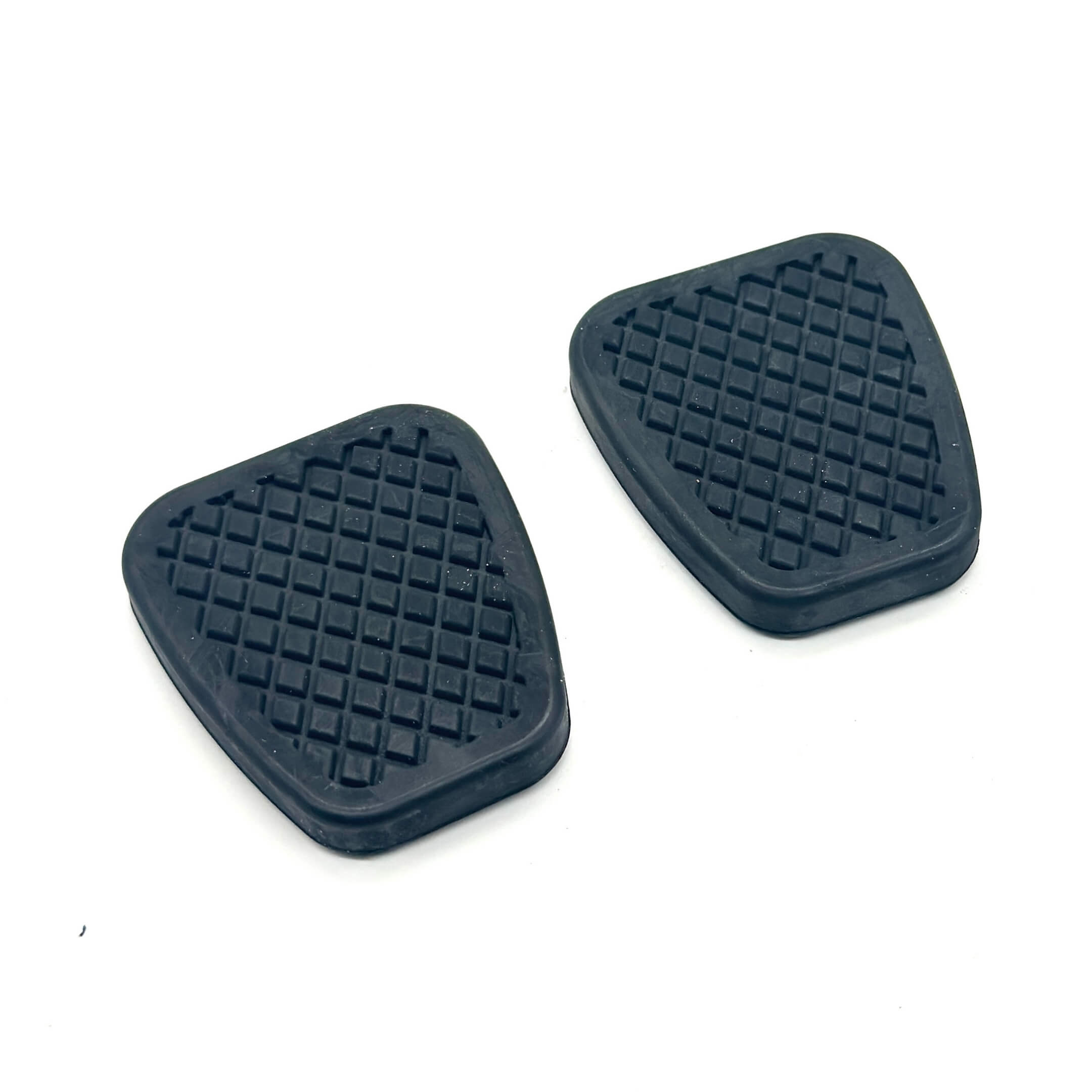 Brake & Clutch Pedal Rubber Pad Set for Honda Acty Truck HA6, HA7 Models 1999-2009, featuring durable black rubber with a textured surface for enhanced grip.