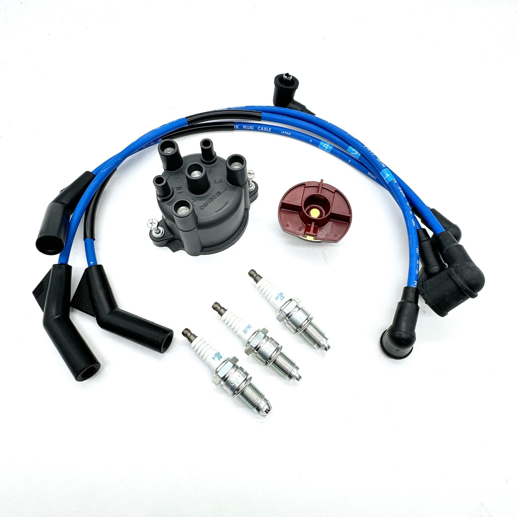 Complete ignition kit for Daihatsu Hijet EFNS engines, featuring OEM distributor cap, rotor, NGK spark plug wires, and spark plugs for S100P/S110P models.