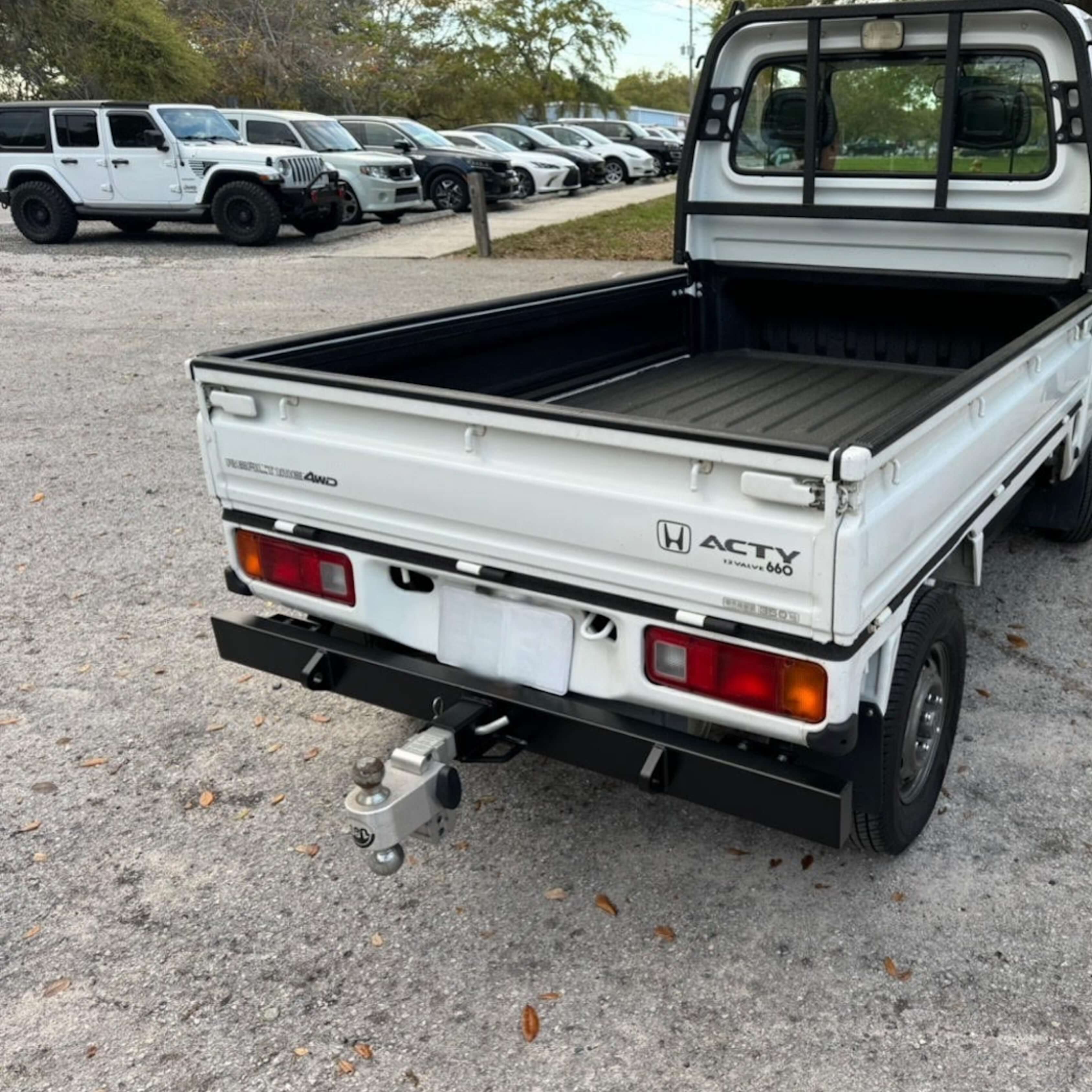 Honda Acty Truck HA4 model rear view featuring installed tow bumper, perfect for towing utility and dump trailers