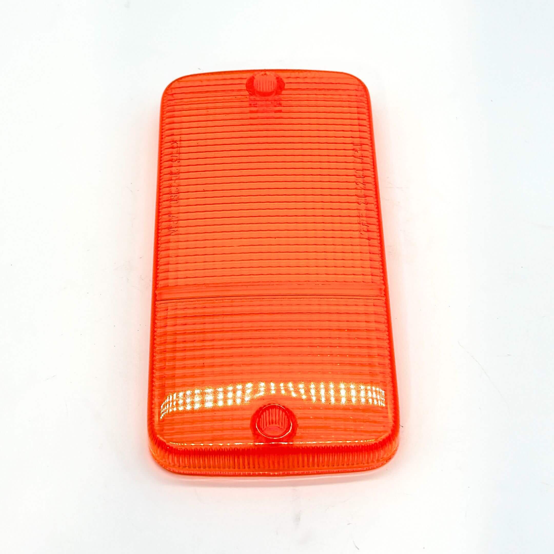 Side profile of the front bumper light lens - left side - in orange, compatible with Honda Acty Truck HA1, HA2, HA3, HA4 models (1988-1999), highlighting the lens's consistent color and textured pattern.