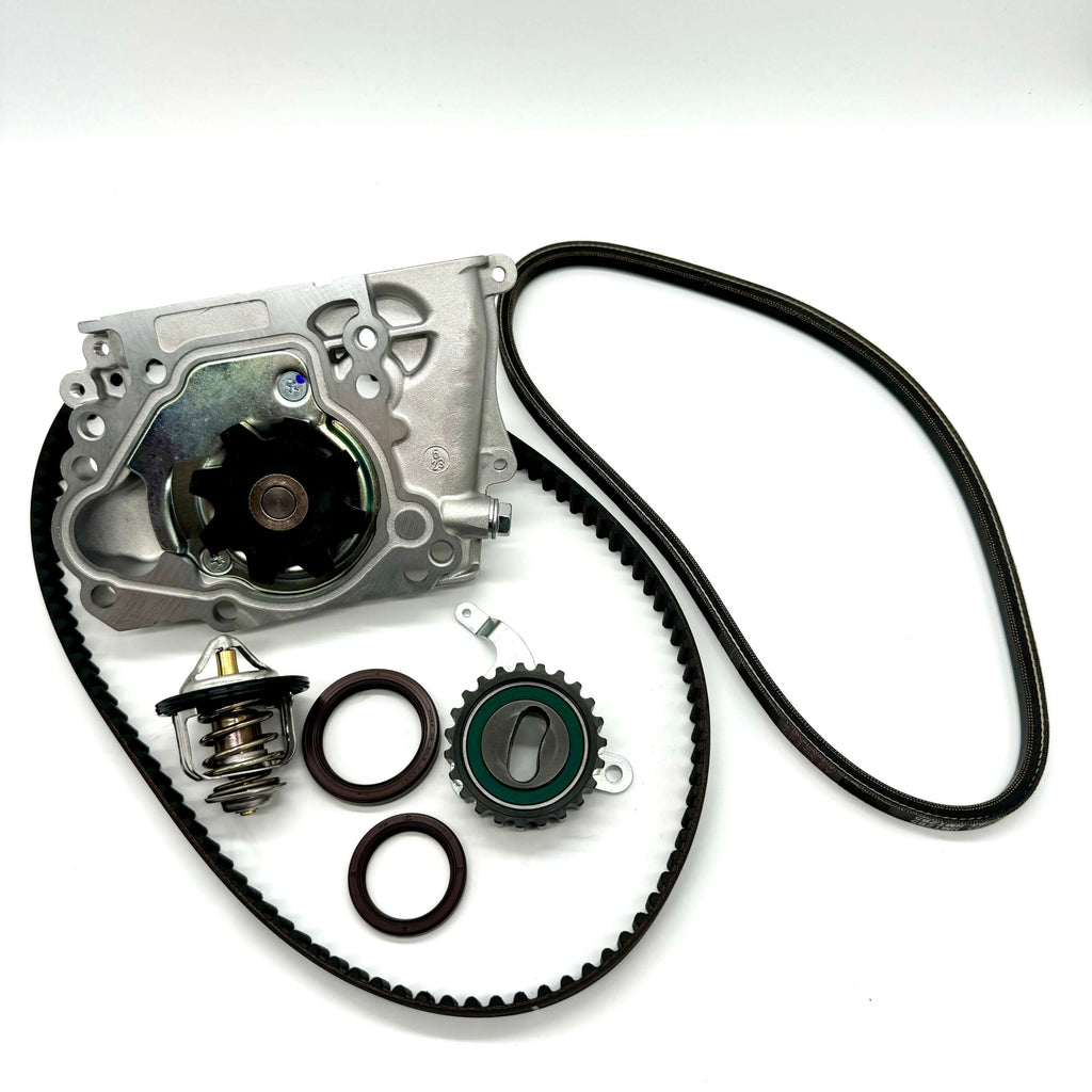 Subaru Sambar KS3 KS4 1990-1998 7-piece timing belt kit featuring timing belt, cam and crank seals, tensioner pulley, water pump with gasket, alternator belt, and thermostat for complete engine timing maintenance.