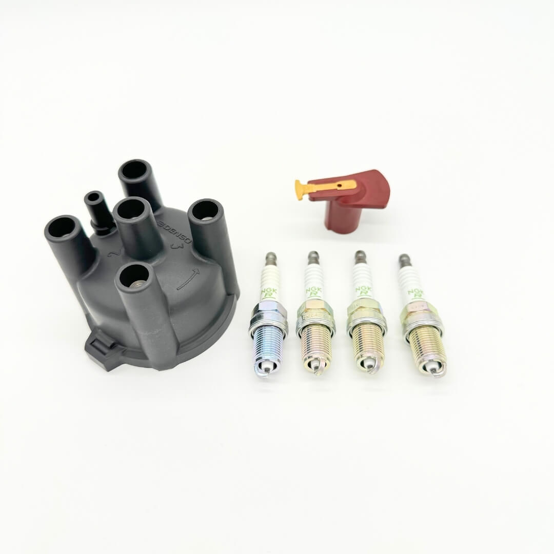 Complete ignition tune-up kit for Subaru Sambar KV3/KV4 1990-1998 featuring distributor cap, rotor, and NGK spark plugs, essential for optimal engine performance, sold by Oiwa Garage.