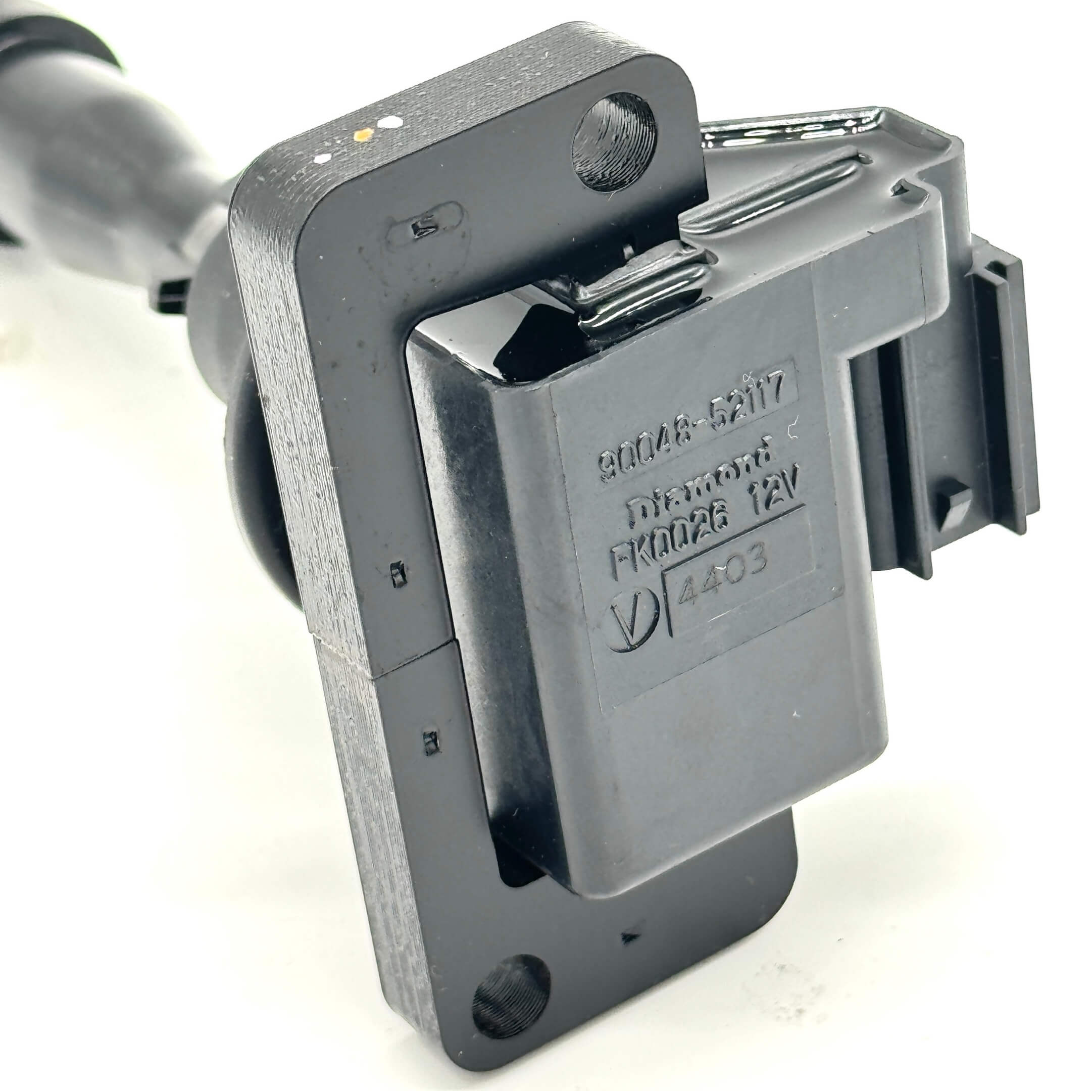 Close-up of a Daihatsu ignition coil, designed for EFGS engines in S100P and S110P Daihatsu Hijet Trucks, showcasing OEM build quality.