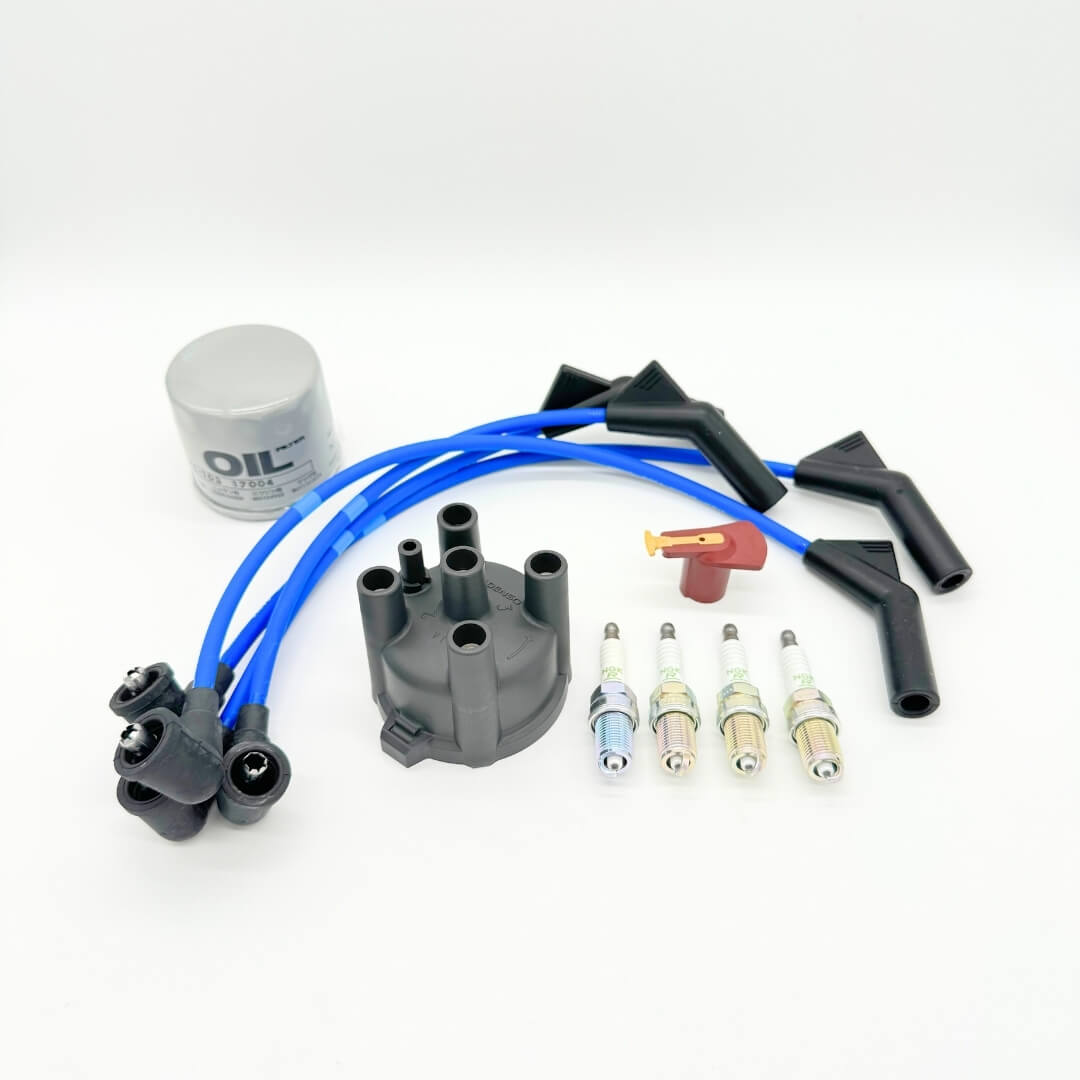 Complete 11-piece ignition kit for Subaru Sambar KV3/KV4 1990-1998, featuring high-quality distributor cap, rotor, spark plugs, wires, and oil filter for optimal engine performance and reliability