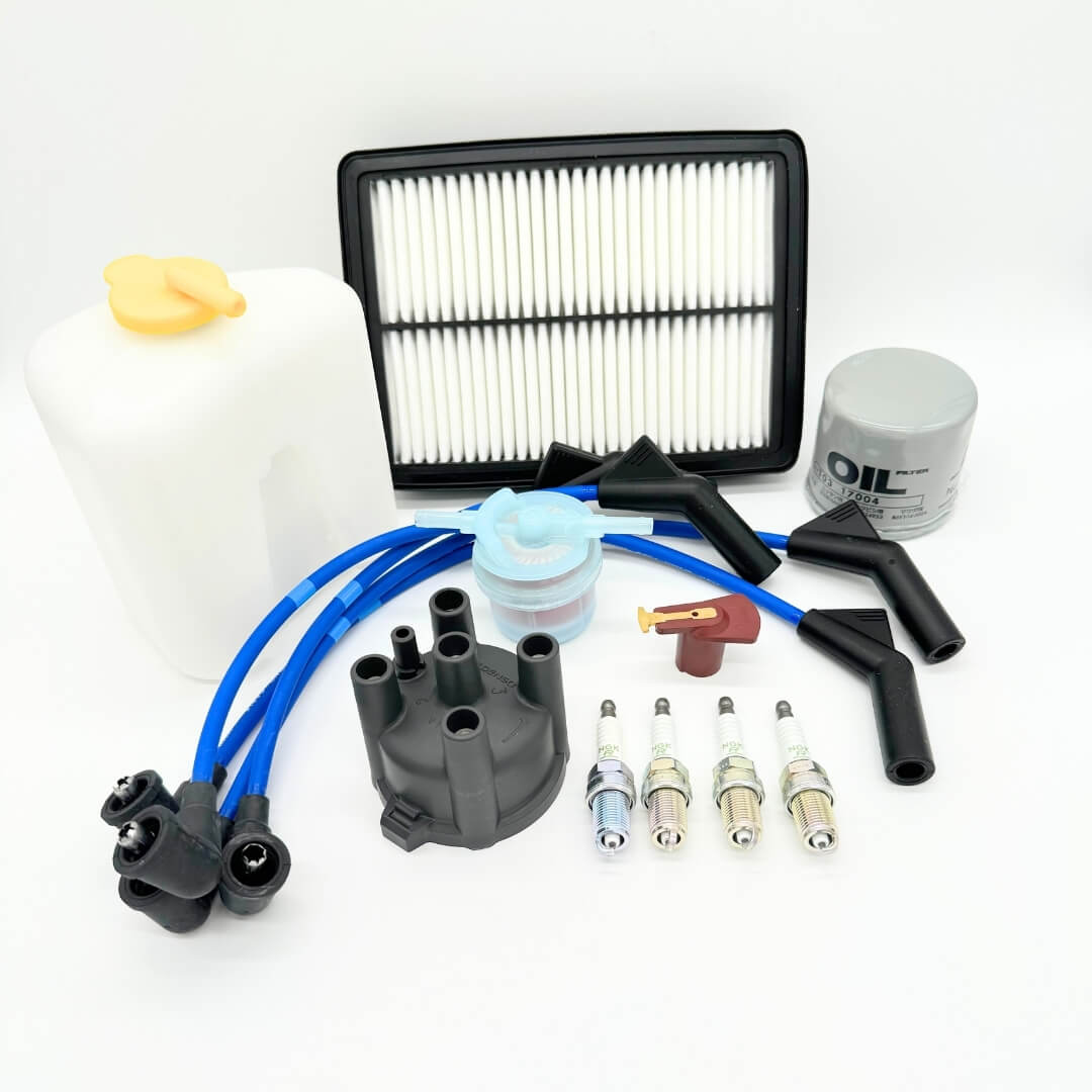 Comprehensive 14-Piece Ignition and Maintenance Kit for 1990-1998 Subaru Sambar KV3, KV4, including distributor cap, rotor, spark plugs, wires, oil filter, fuel filter, air filter, and coolant reserve tank.