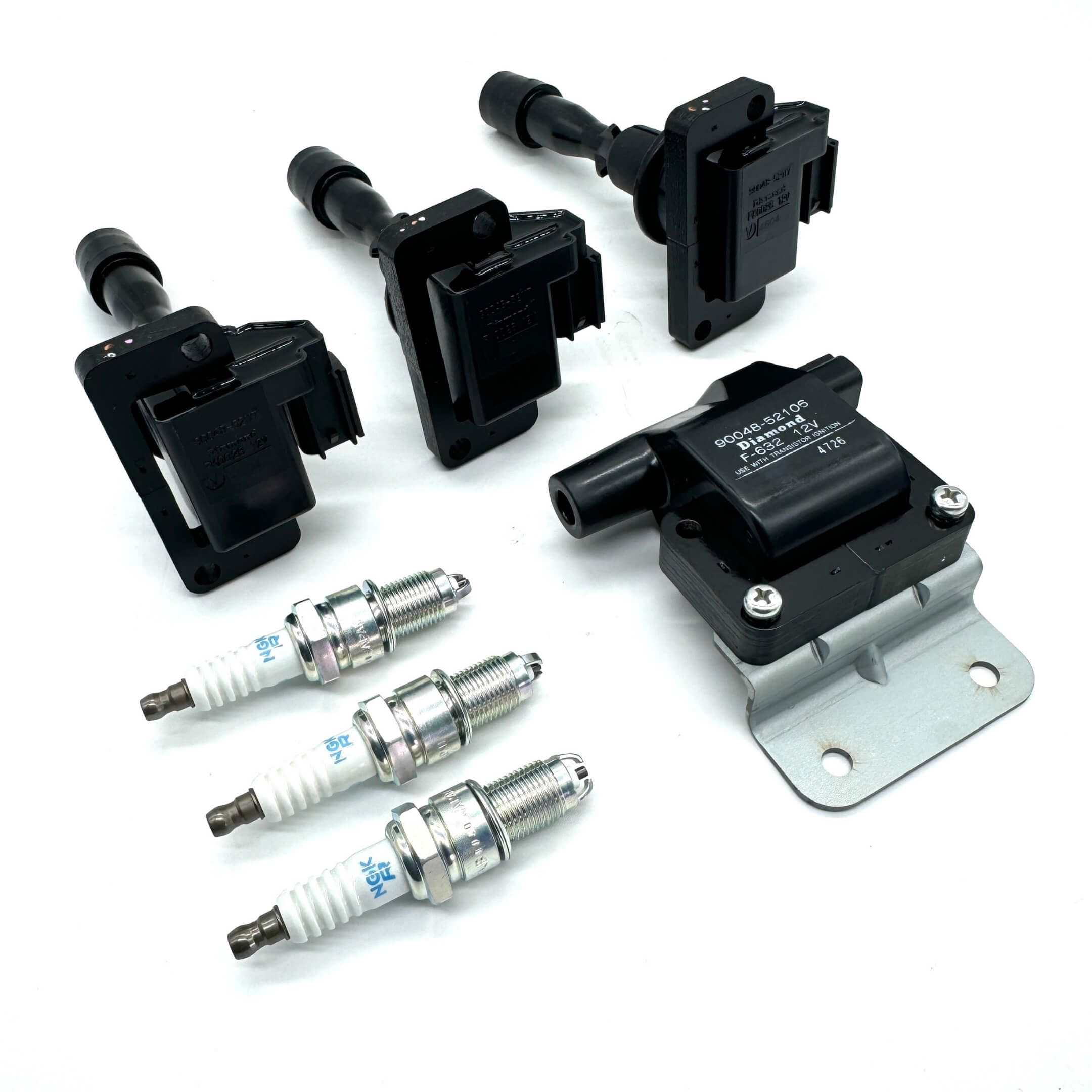 7-Piece Ignition Kit for Daihatsu Hijet S100P, S110P (1994-1998) EFGS engines, including NGK spark plugs and Genuine Daihatsu ignition coils.