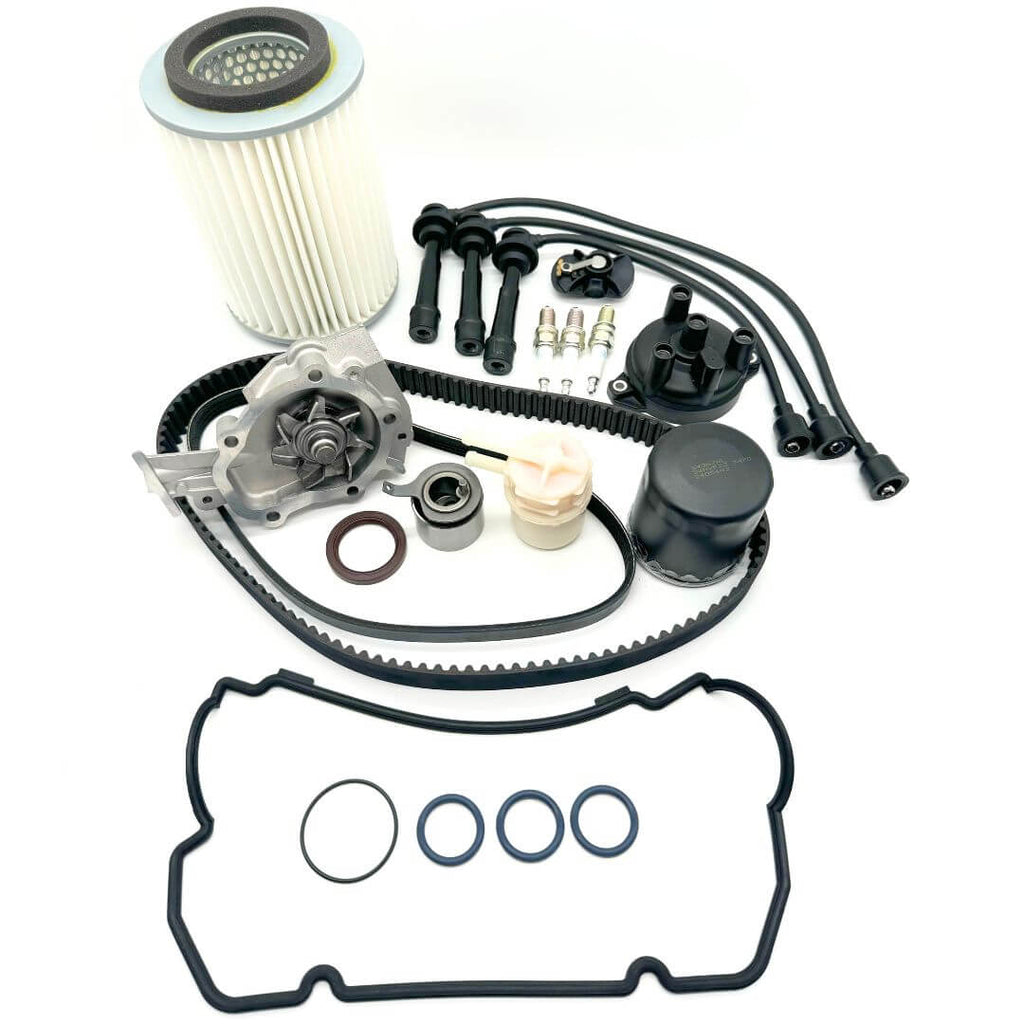 Comprehensive timing belt kit for Suzuki Carry DC51T and DD51T (1991-1998) including timing belt, alternator belt, water pump, pulley, cam seal, valve cover gasket, fuel filter, oil filter, air filter, spark plugs, plug wires, rotor, and distributor cap. Essential for optimal performance and smooth operation of Japanese mini trucks.