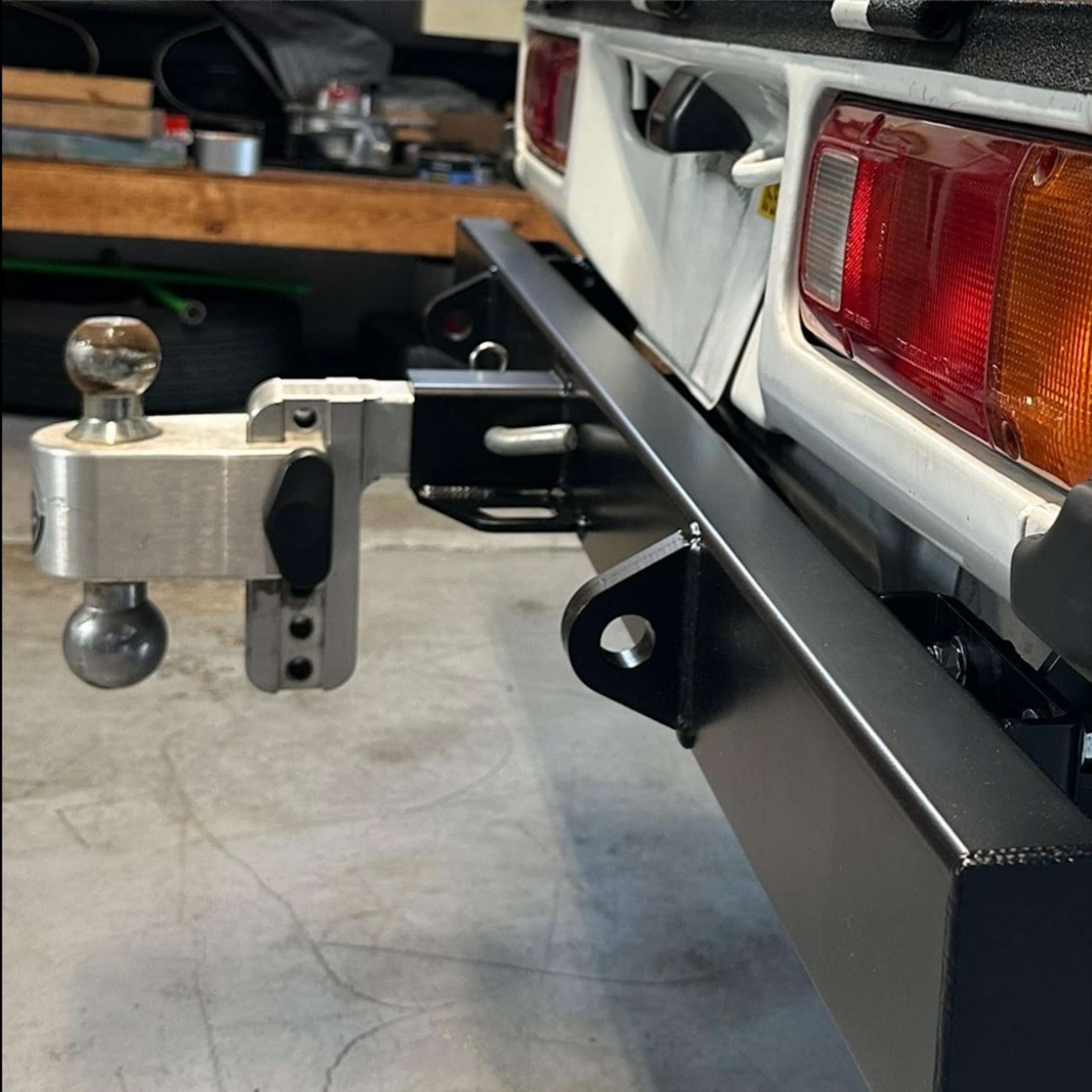 Detailed view of rear tow bumper with hitch mount on Honda Acty Truck HA4 model, suitable for various trailers