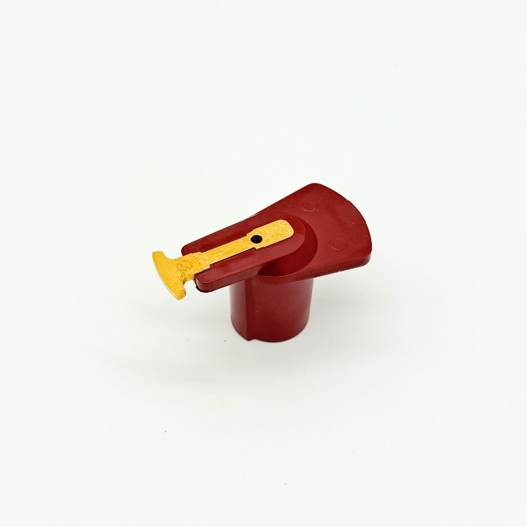 Top-view of a red distributor rotor for Subaru Sambar KS3, KS4 models, showing the distinctive yellow contact point and part number, compatible with 1990-1998 vehicles