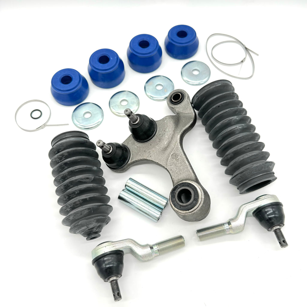 19-piece steering and suspension upgrade kit for Honda Acty HA3, HA4 models (1990-1999) - includes outer tie rods, rubber boots, polyurethane bushings, metal washers, sleeves, clamps, and central steering link for comprehensive vehicle upgrade