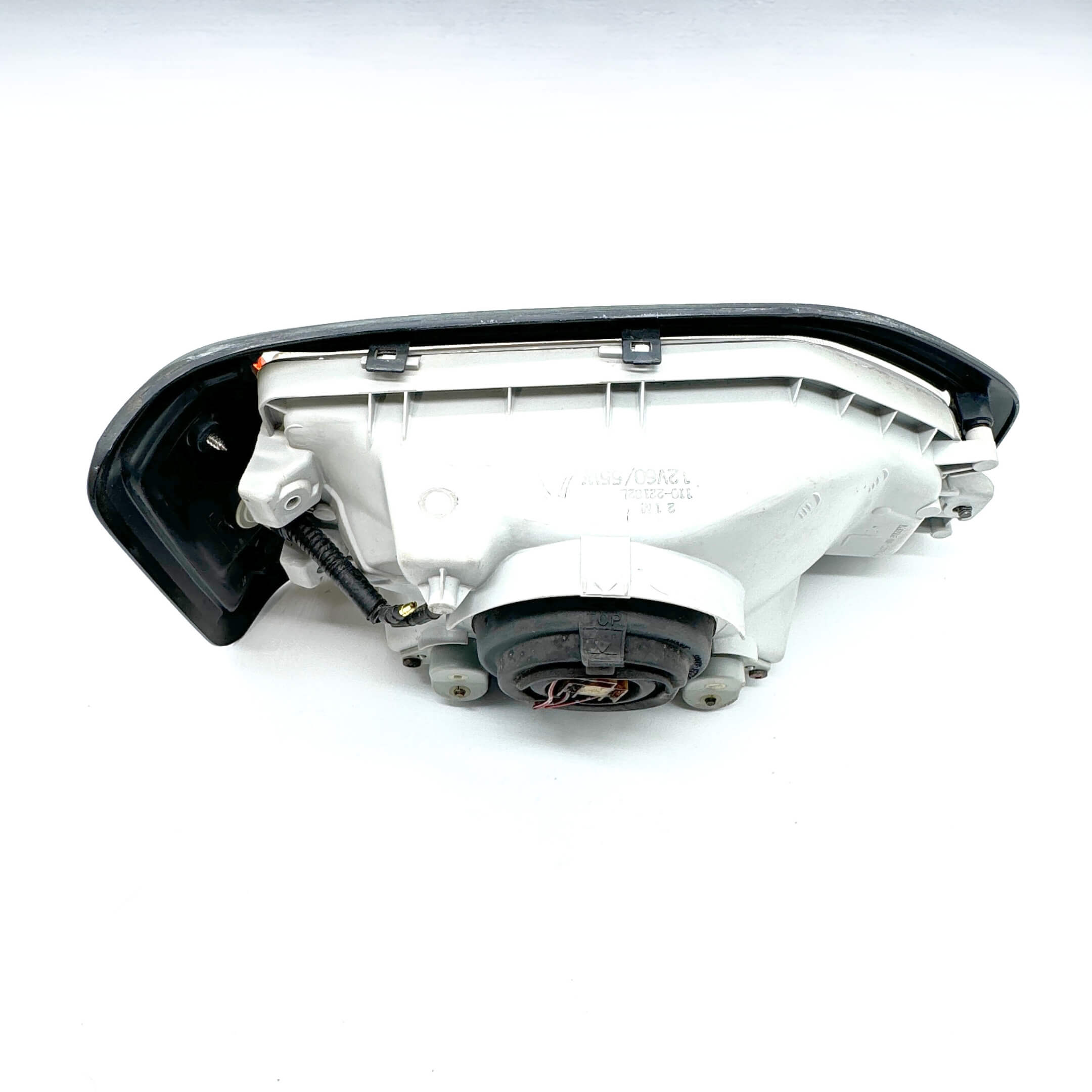 Backside view of Left Headlight Assembly for Honda Acty Truck HA3, HA4 models (1990-1993) with detailed connector placement