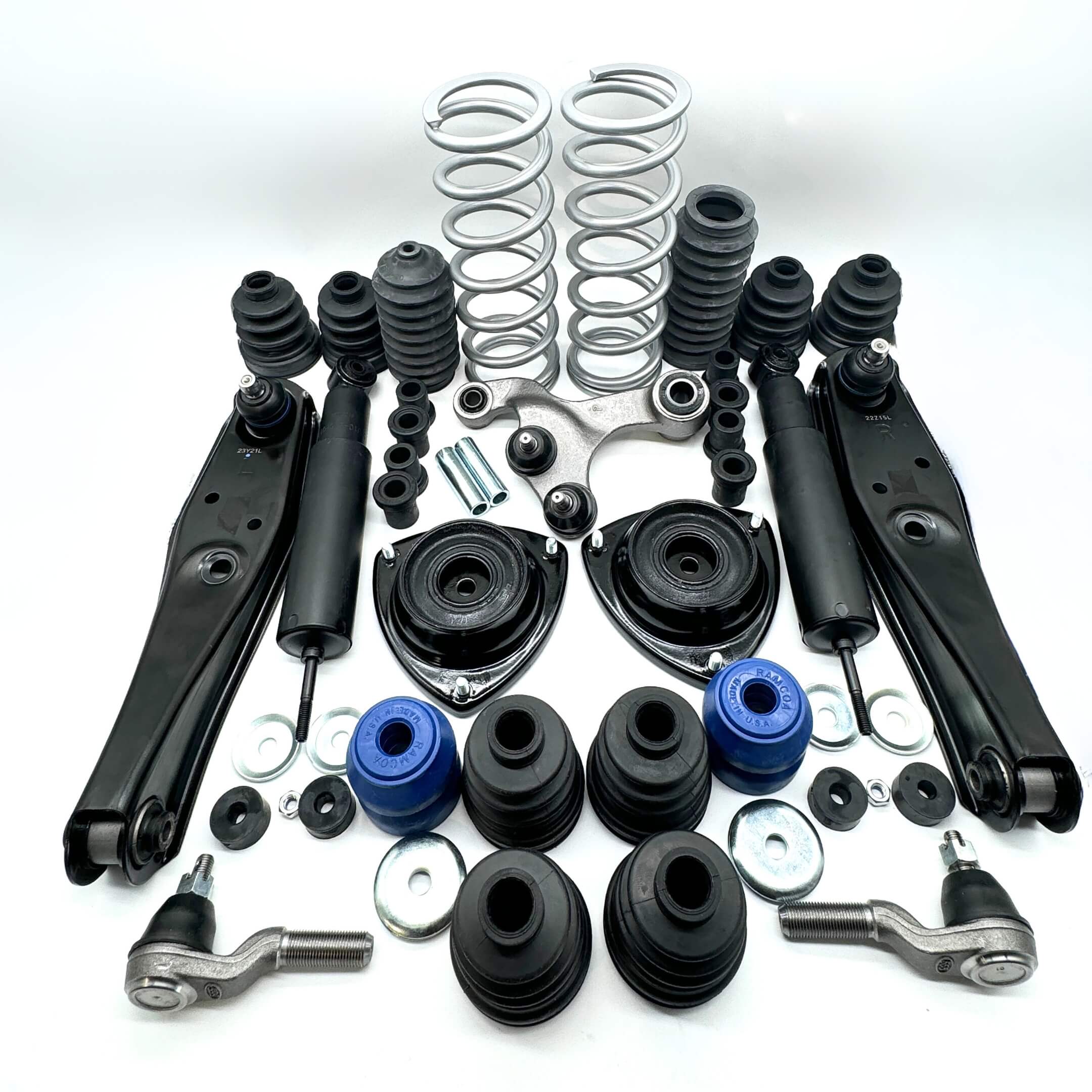 Complete suspension and steering upgrade kit displayed on white background, including springs, shock absorbers, control arms, for Honda Acty Truck 1990-1999.