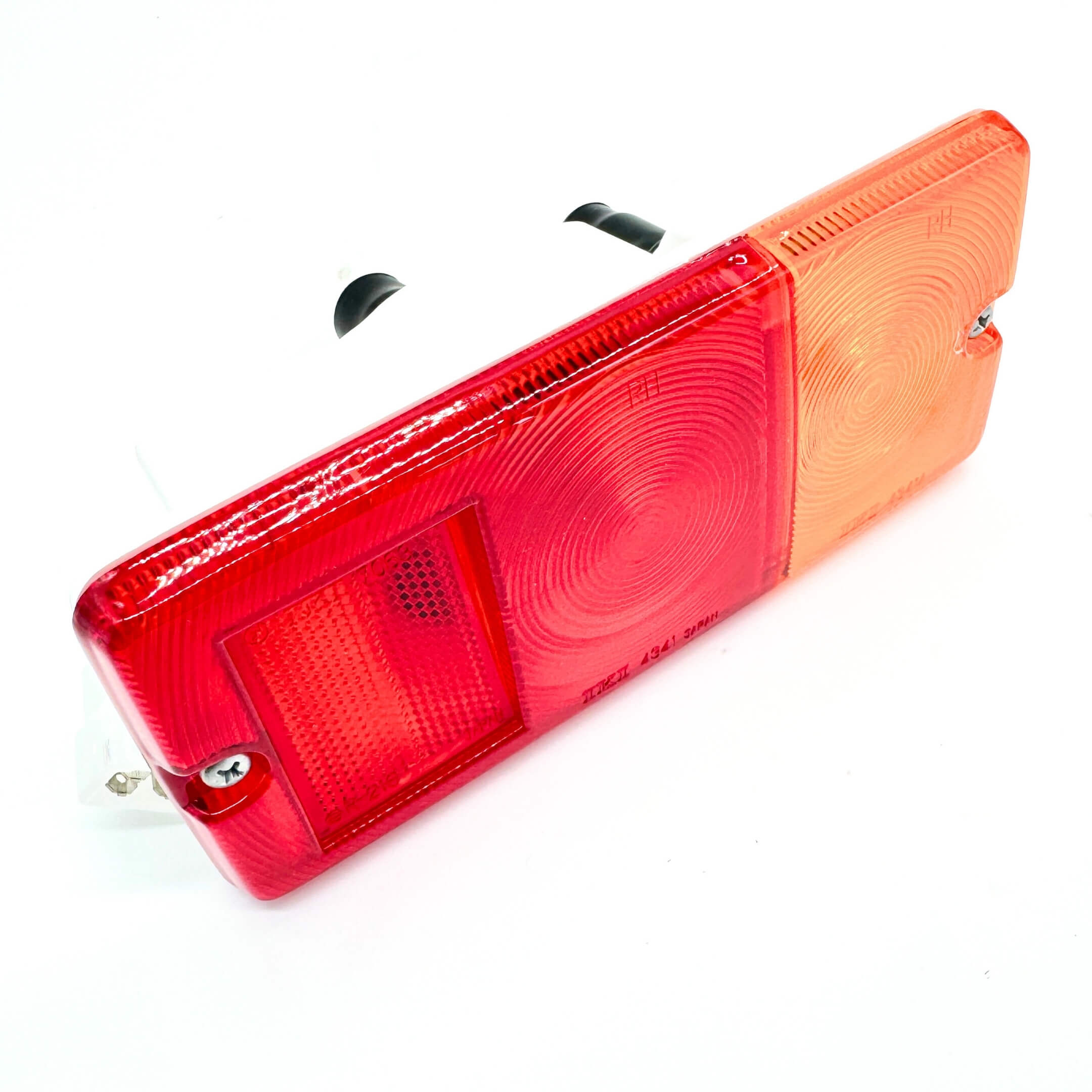 Close-up of Daihatsu Hijet Truck rear tail lamp assembly, showcasing dual-tone red and amber lens, designed for driver side of S100P and S110P models.