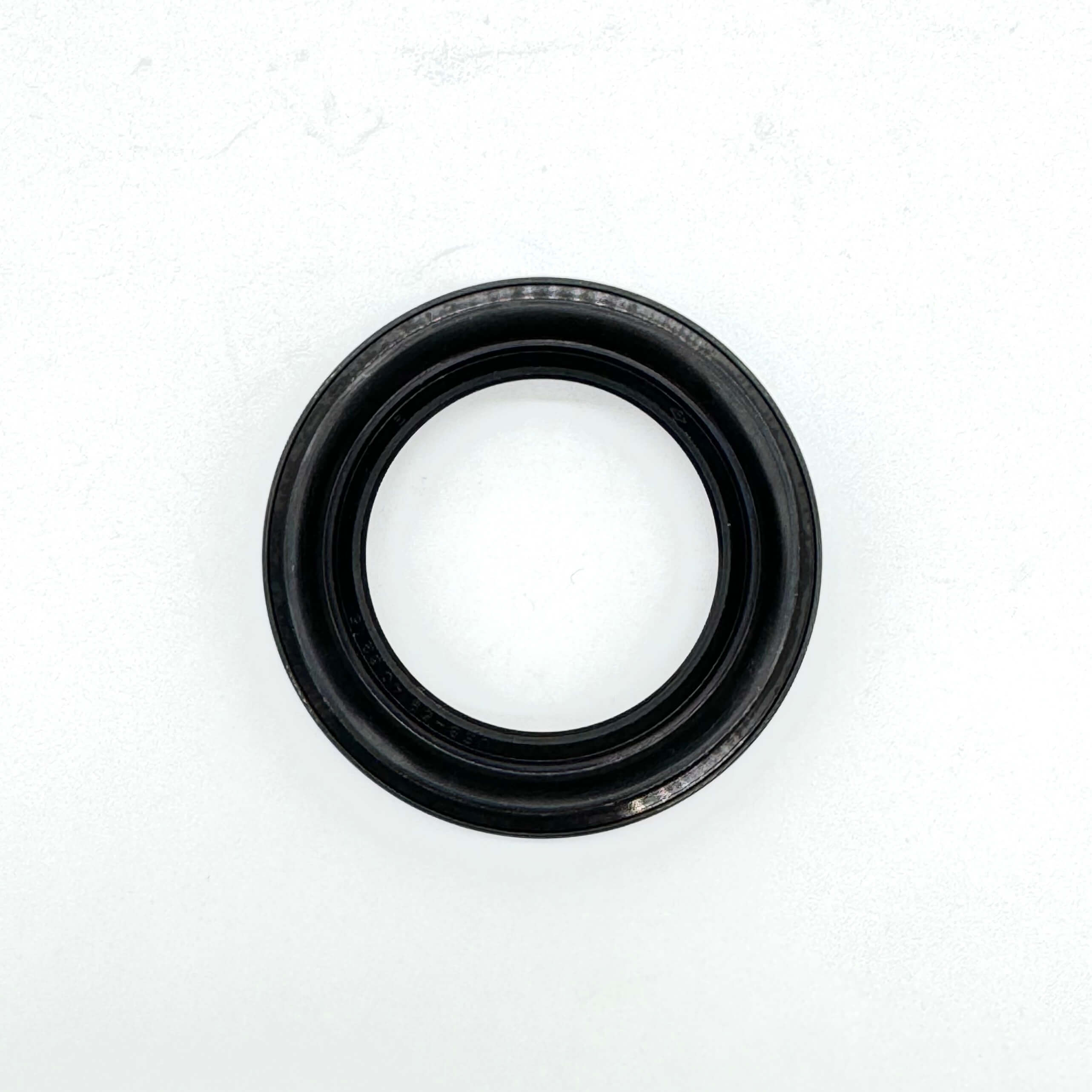 Durable rubber seal for rear left wheel bearing of Honda Acty Truck, fits HA3, HA4 models from 1990 to 1999.