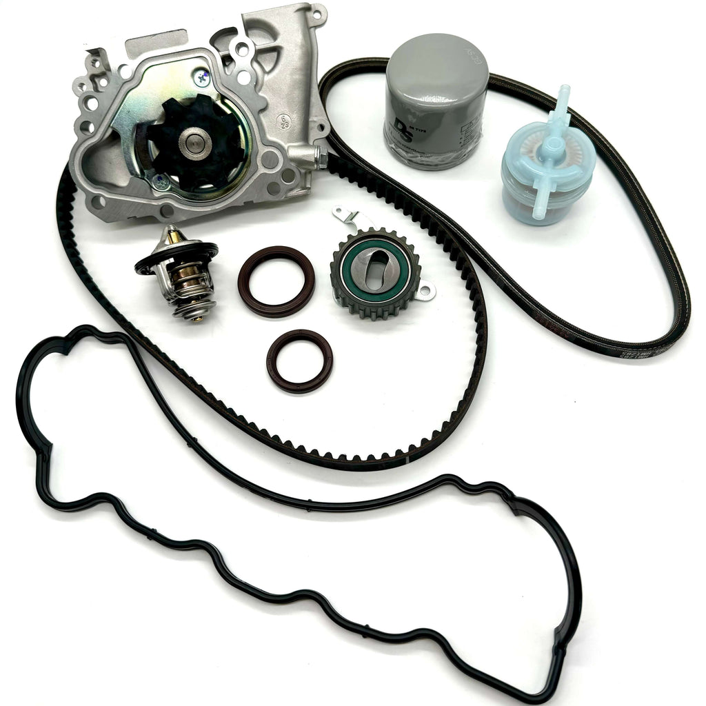 Subaru Sambar KS3 KS4 1990-1998 complete 10-piece timing belt kit with timing belt, tensioner pulley, cam and crank seals, water pump, alternator belt, thermostat, valve cover gasket, oil and fuel filters for full engine service.