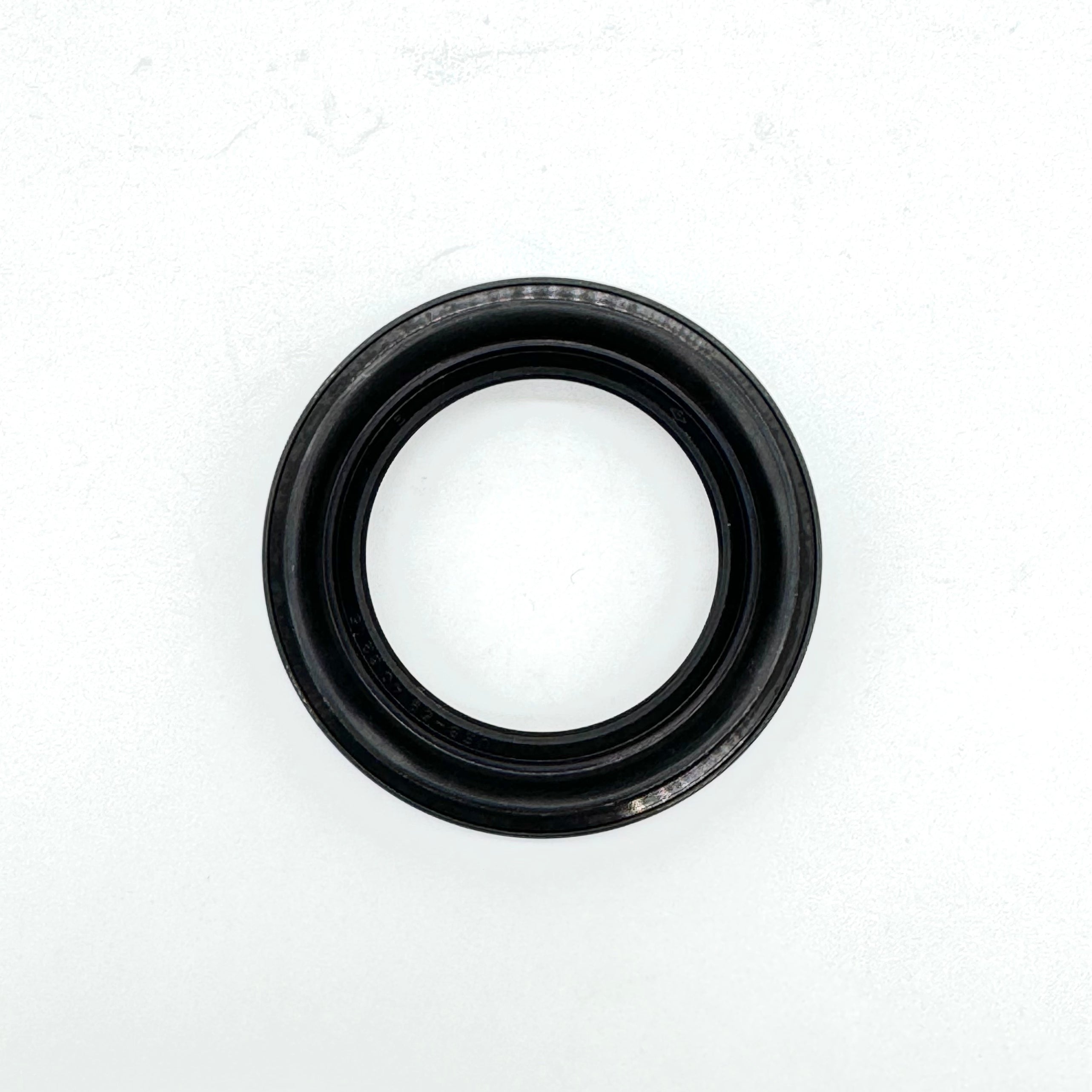 Close-up of the rear right outer wheel seal for 1990-1999 Honda Acty HA3, HA4, crucial for wheel bearing protection.