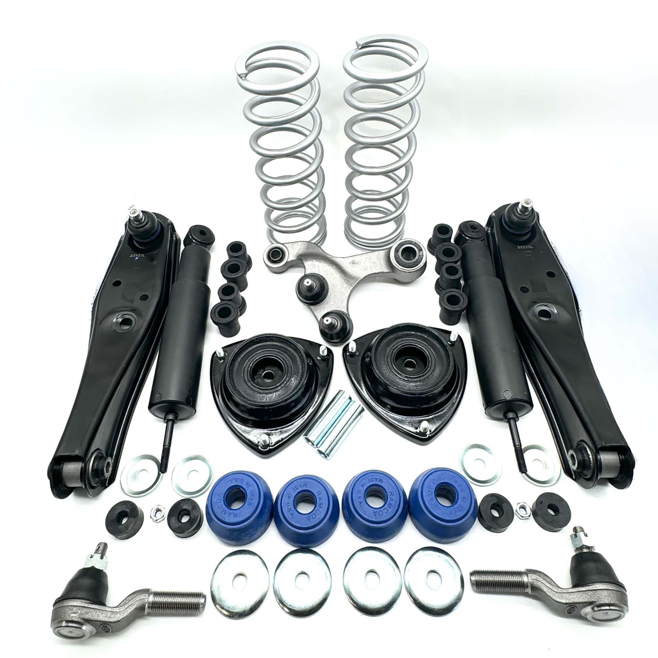 Complete suspension upgrade kit for Honda Acty HA3, HA4 1990-1999, featuring black shock absorbers, control arms, tie rods, and blue bushings.