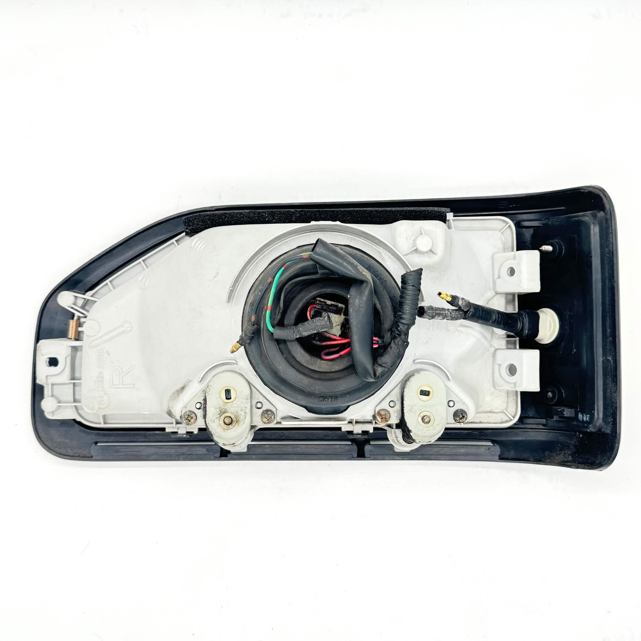 Rear view of right headlight assembly for Honda Acty Truck HA3, HA4 models 1990-1993 showing wiring and connectors.