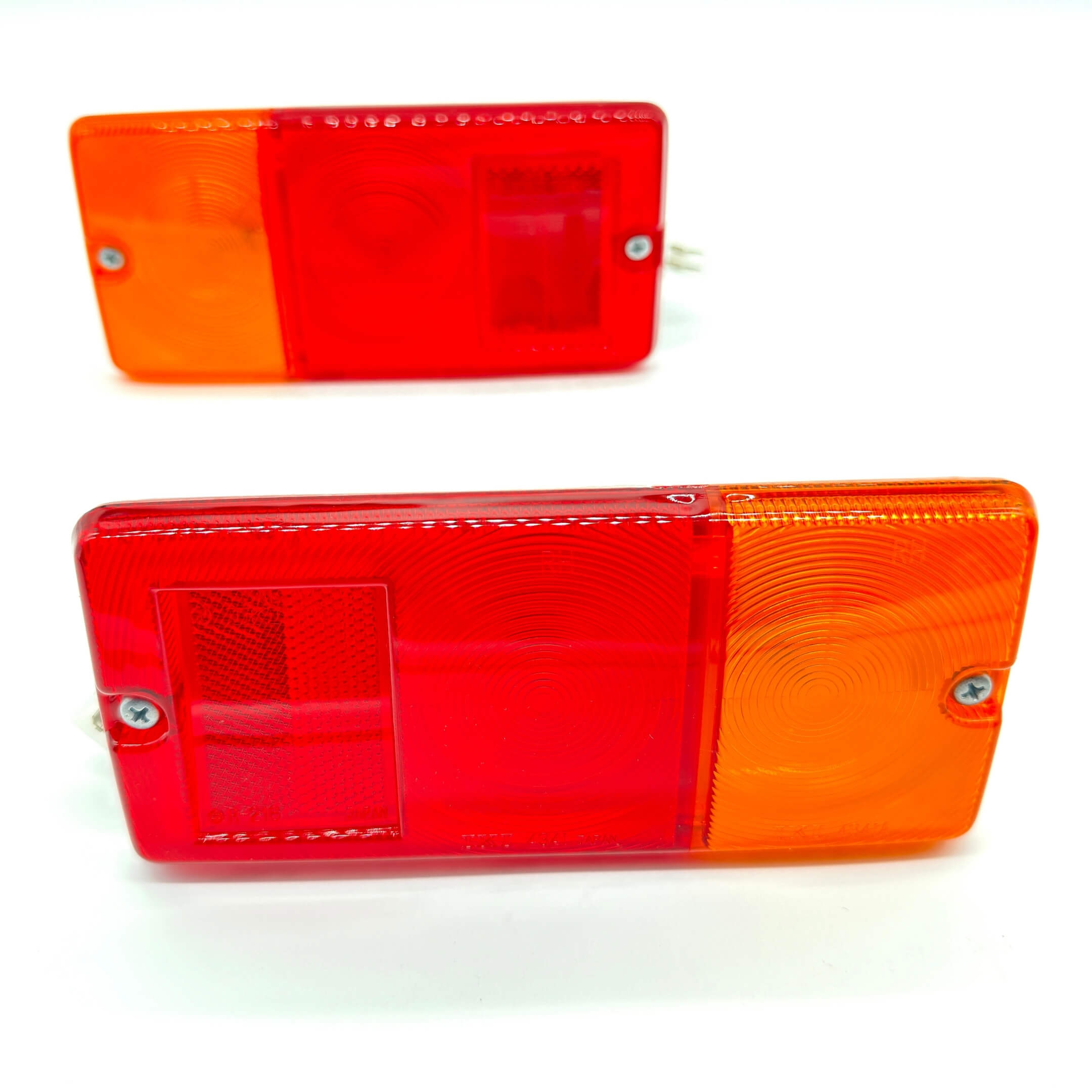 Complete set of Genuine Daihatsu rear tail lamp assemblies for S100P, S110P Daihatsu Hijet Trucks (1994-1998), featuring dual-tone red and amber lens.