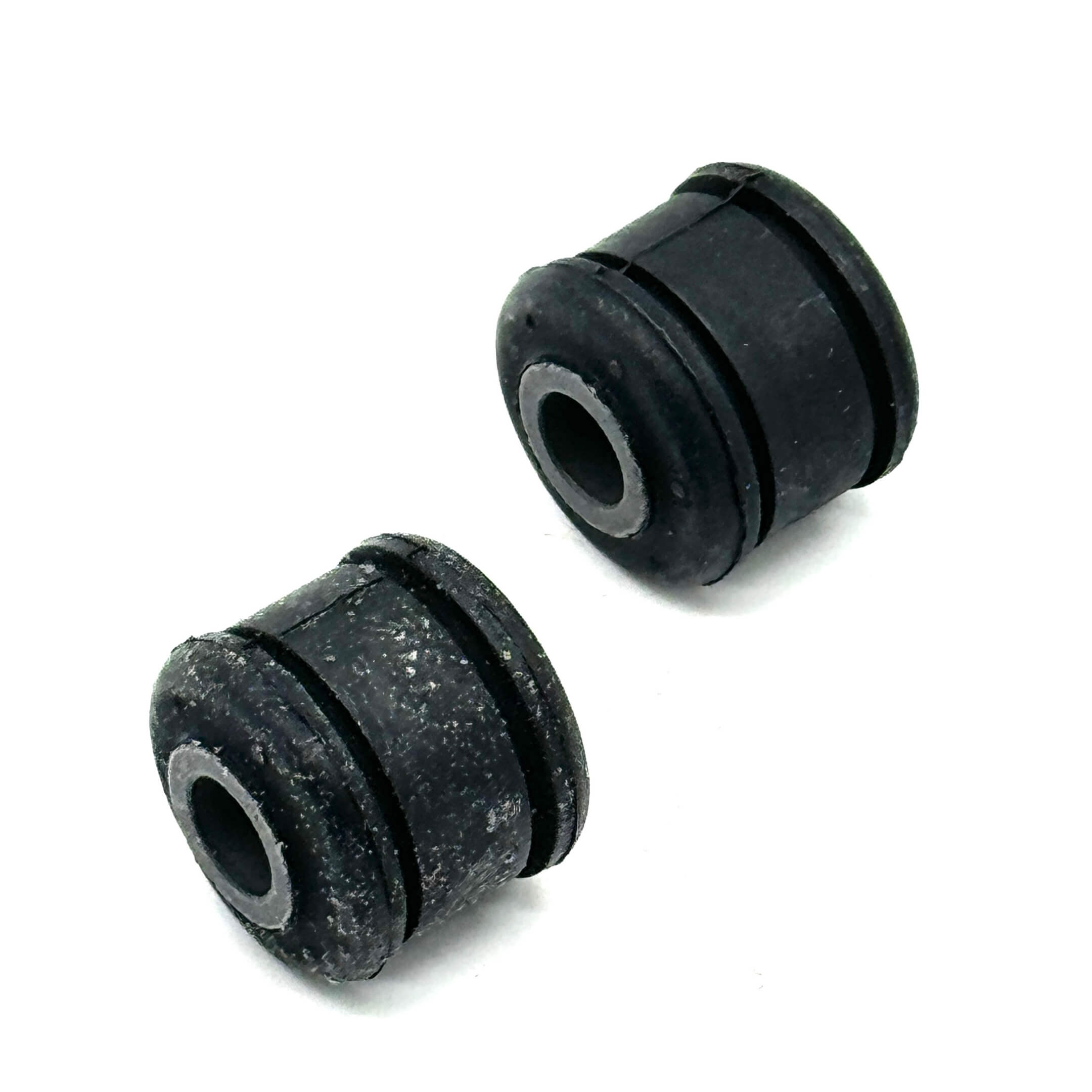 Pair of rear shock bushings for Honda Acty Truck HA6, HA7 models (1999-2009), showcasing durable materials and precise fit.