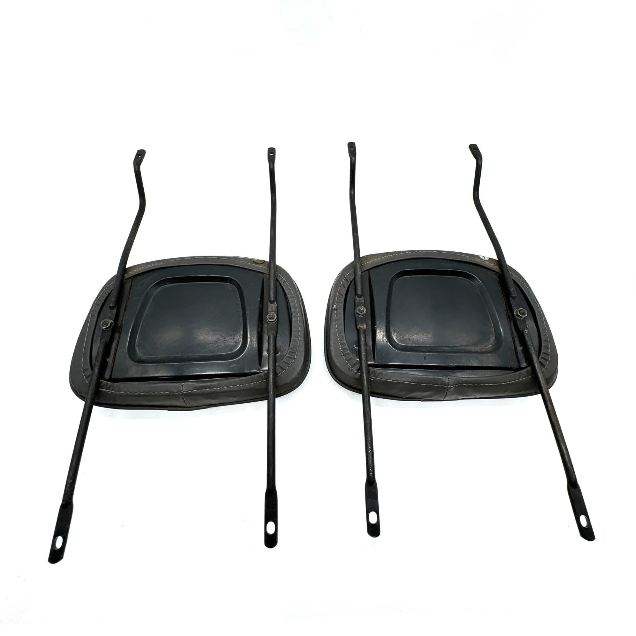 Back view of lightly used headrest for Honda Acty, demonstrating attachment rods and back panel.