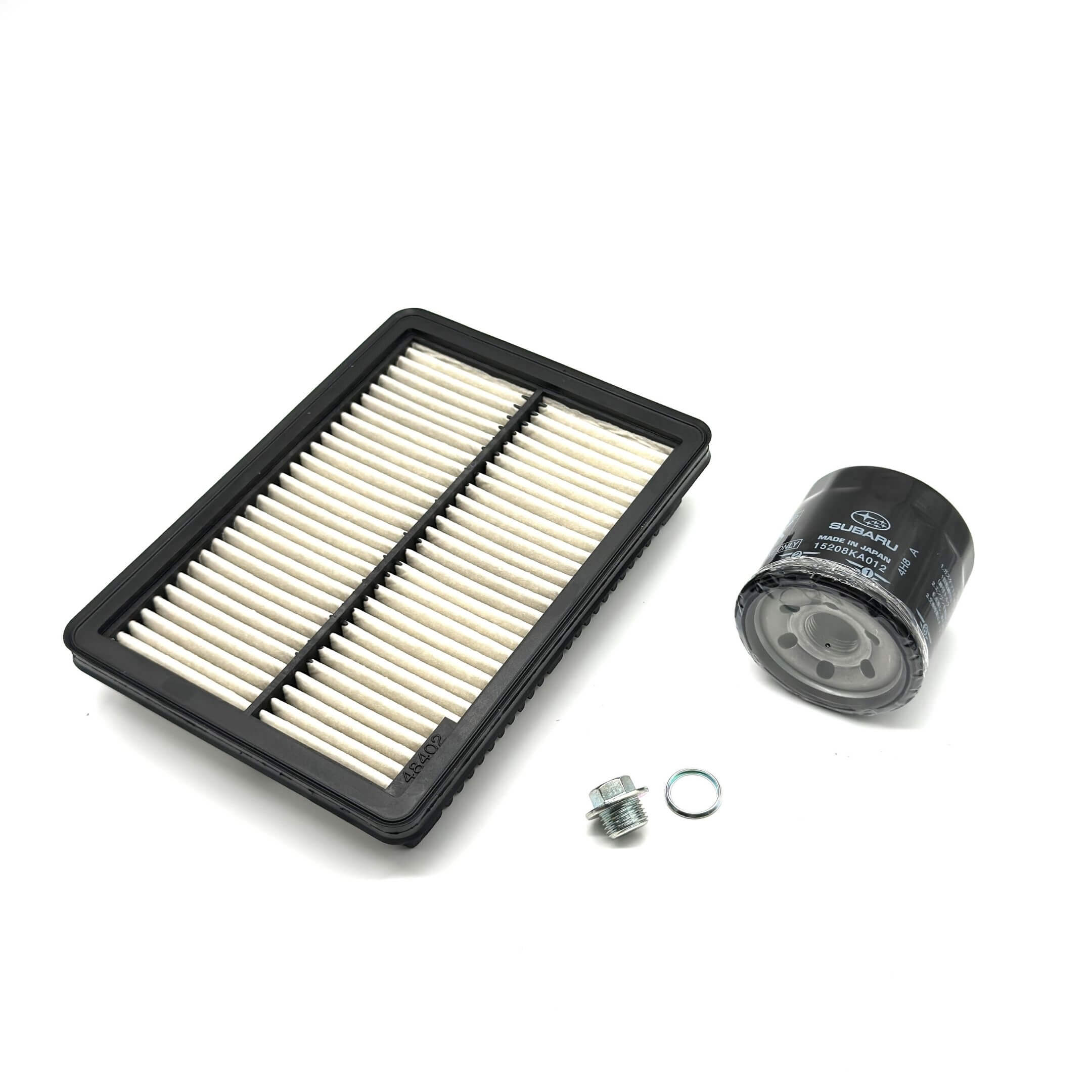 Genuine Subaru Sambar Van TV1, TV2 air filter, oil filter, and drain plug set for 1999-2012 models, featuring a black and white air filter and black oil filter.