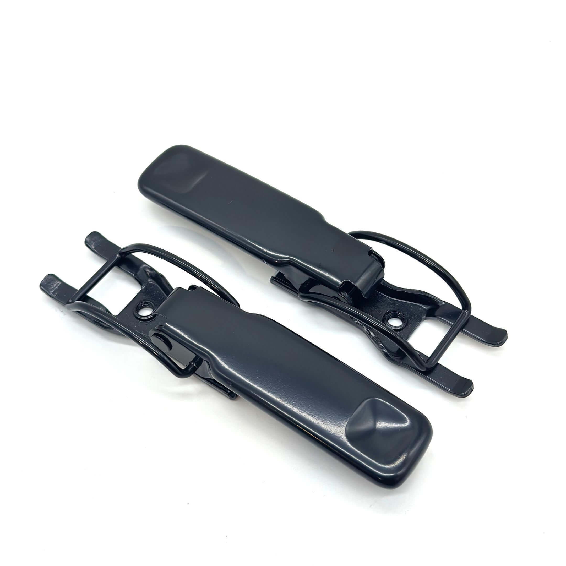 Close-up angled view of Subaru Sambar bed gate latch assembly with corrosion-resistant black coating.