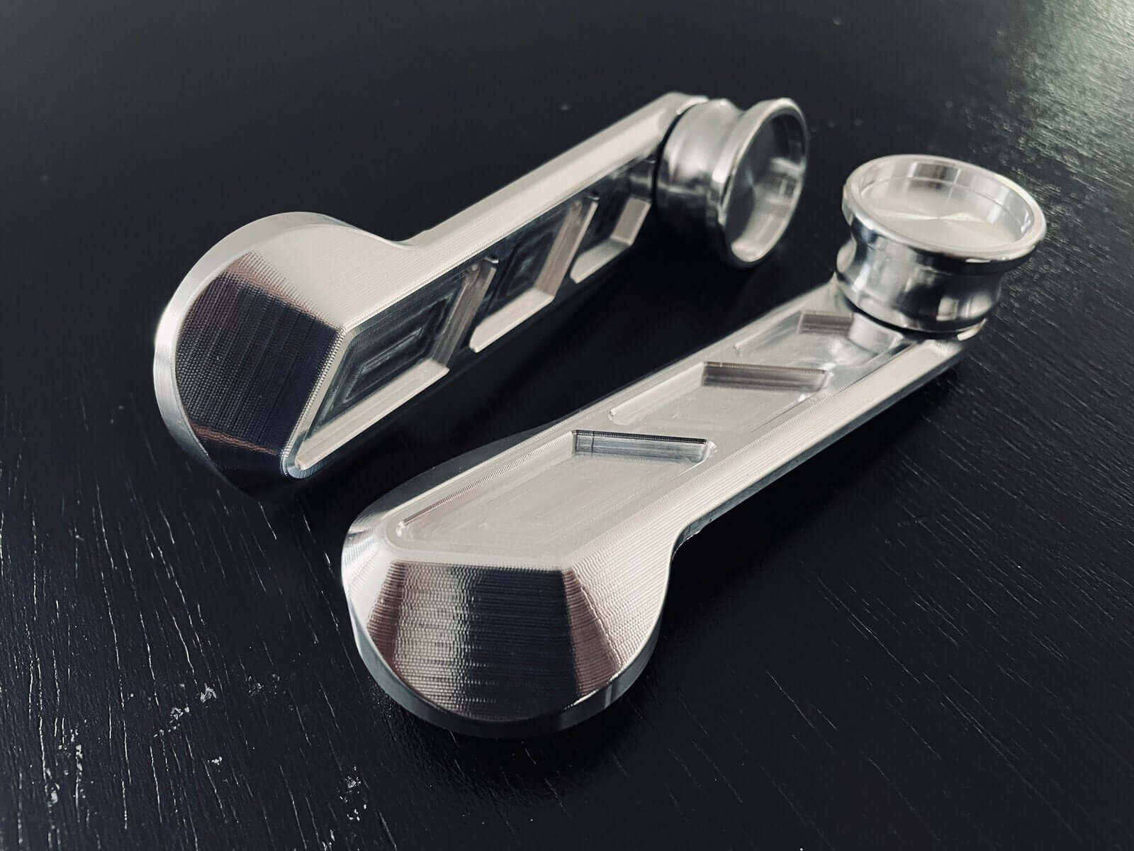 Precision-crafted window crank handles with 3D contouring from 6061 aluminum, designed for a seamless fit in Honda Acty Trucks and Civic models from 1988 to 1999.