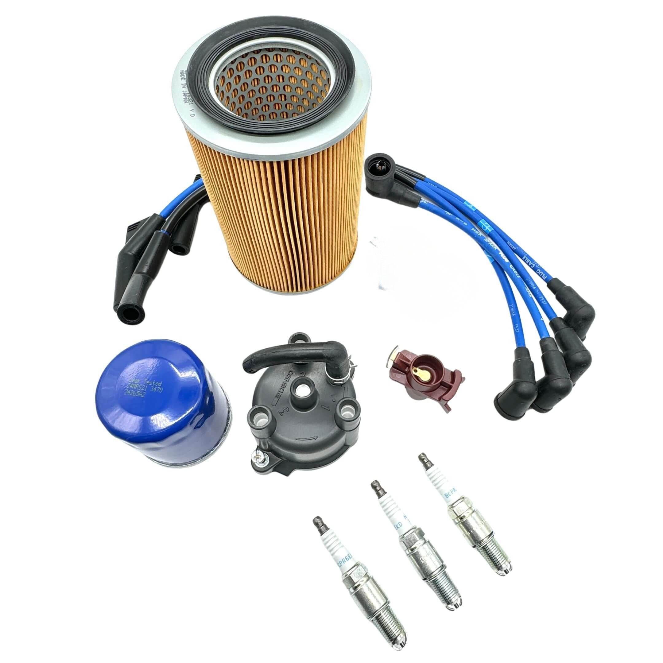 Hijet Truck S100P/S110P EFI ignition kit top view showing distributor cap, rotor, 3 plug wires, air and oil filters, spark plugs.