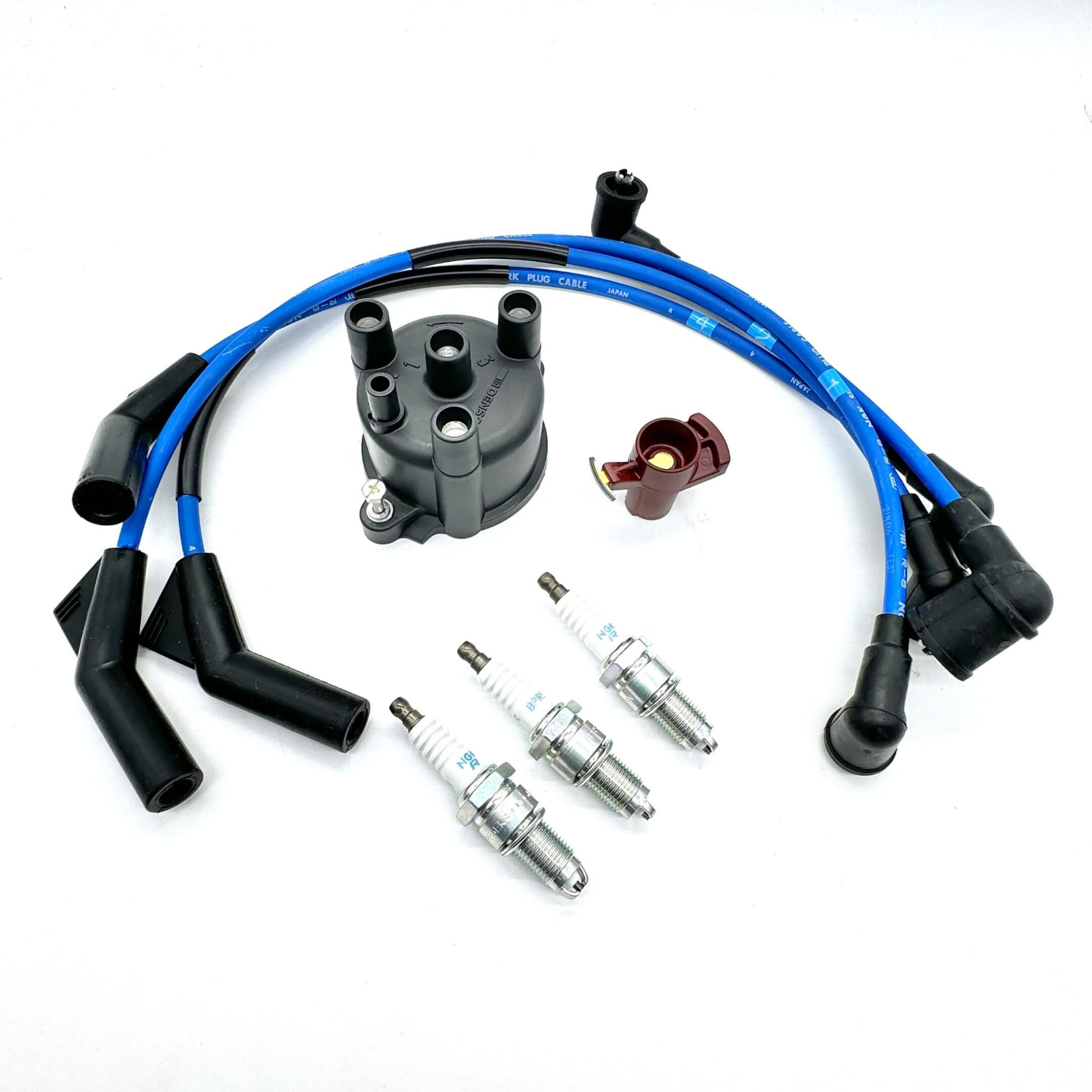 Daihatsu Hijet Truck S100P, S110P (1994–1998)  ignition kit featuring black distributor cap, red ignition rotor, blue high-tension spark plug wires, and three NGK spark plugs – Ignition Kits collection.