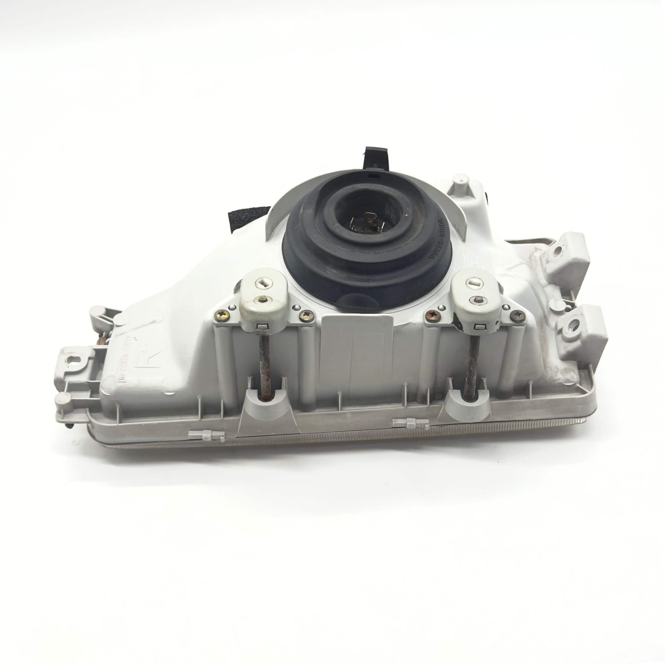 Headlight - Right / Driver Side for Honda Acty Truck Models HA3, HA4 (1990-1993) featuring a durable housing and mounting components.