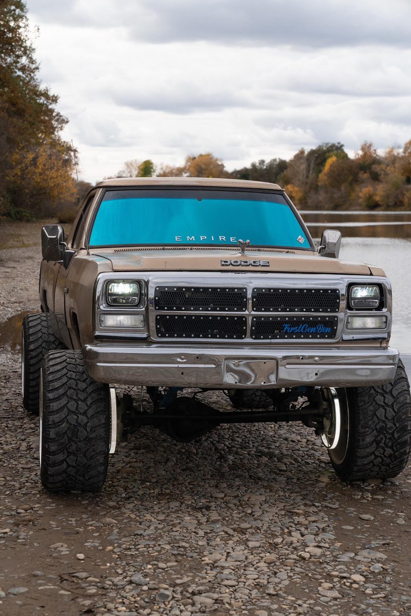 Front view of a Dodge truck with Omnique Design Bellagio Blue tint, providing UV protection and a bold blue finish.