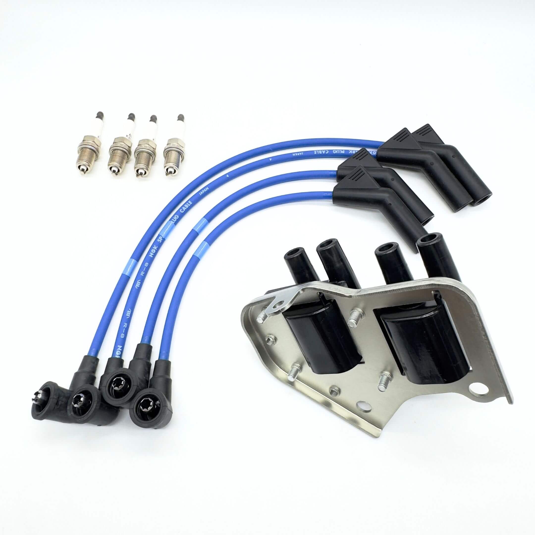 Ignition Kit for Subaru Sambar Truck TT1, TT2 Models (2/1999 - 8/2001) featuring blue spark plug wires, spark plugs, and ignition coil assembly.