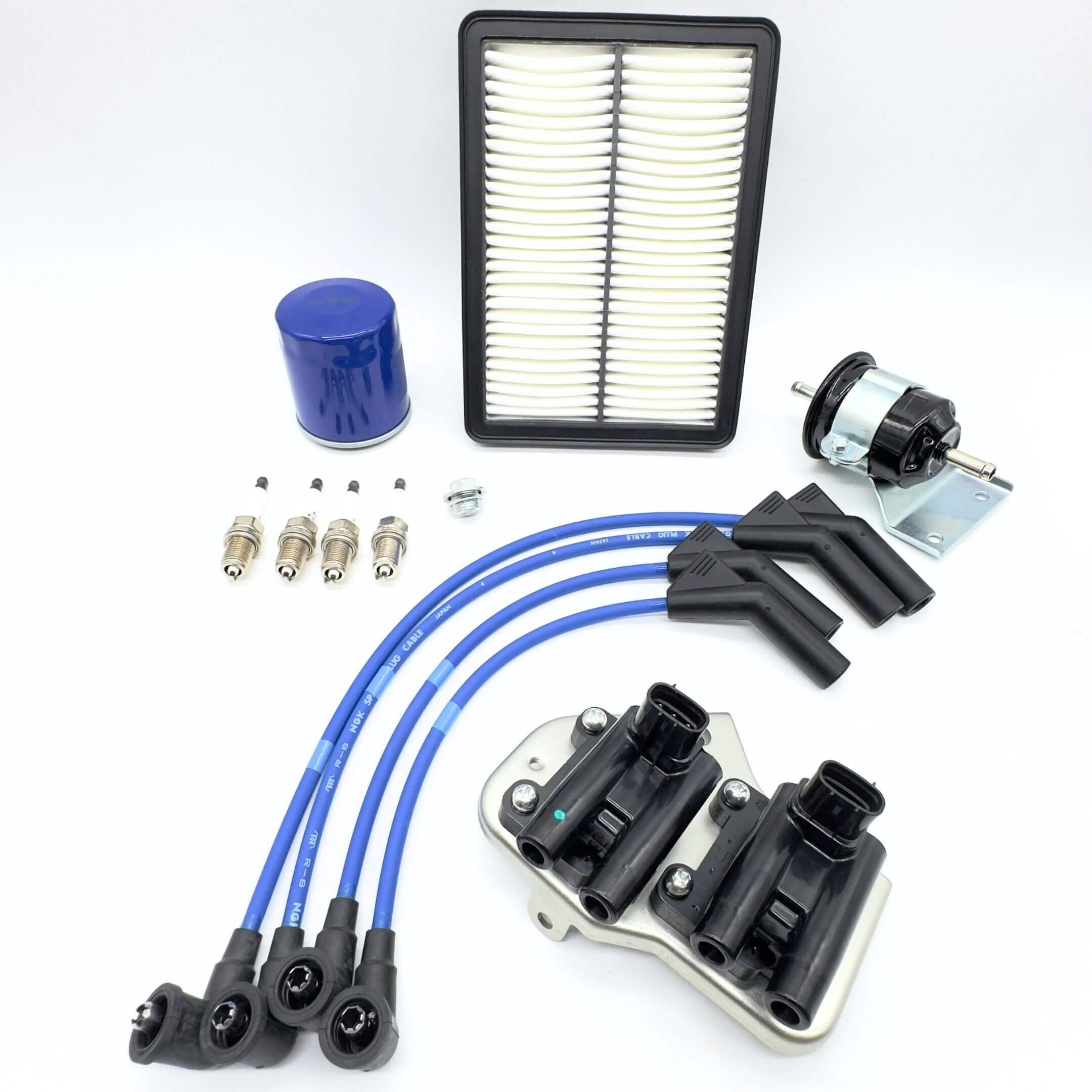 Ignition Kit - 7 Piece for Subaru Sambar Truck TT1, TT2 Models, featuring blue spark plug wires, spark plugs, ignition coil assembly, blue oil filter, air filter, and fuel filter, compatible with E...