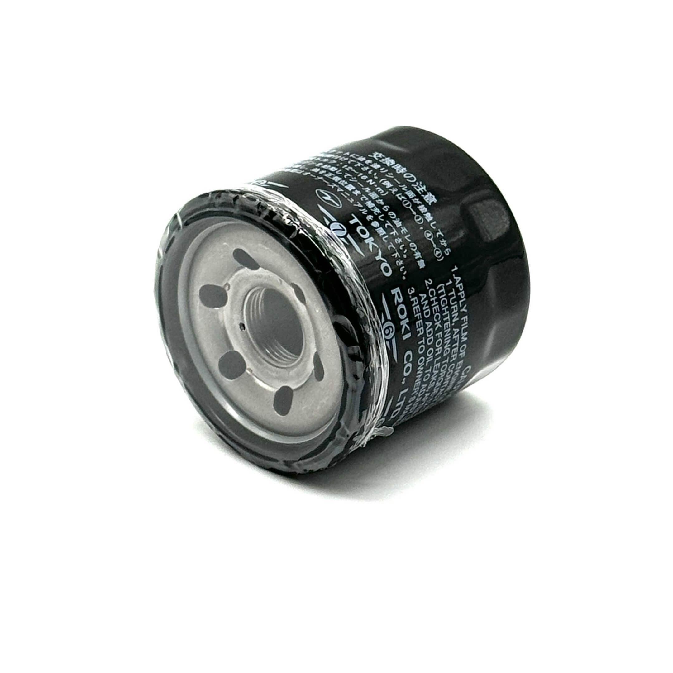 Genuine black oil filter for Subaru Sambar Truck TT1, TT2 models, 1999-2012, featuring detailed specifications on the surface.