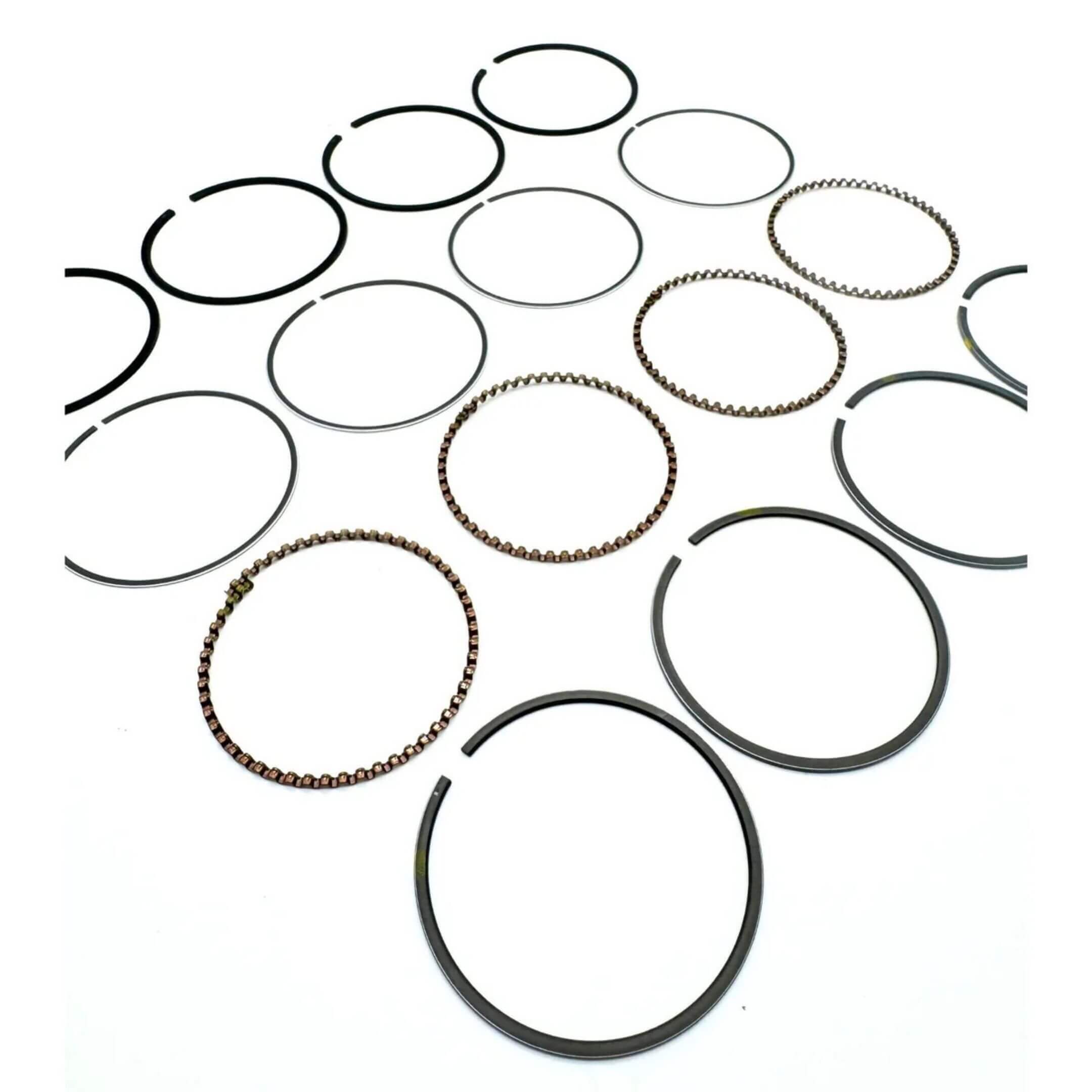 Piston Ring STD Size for Subaru Sambar Van TV1, TV2 Models (1999-2012), featuring a set of metallic rings with varied textures and finishes.