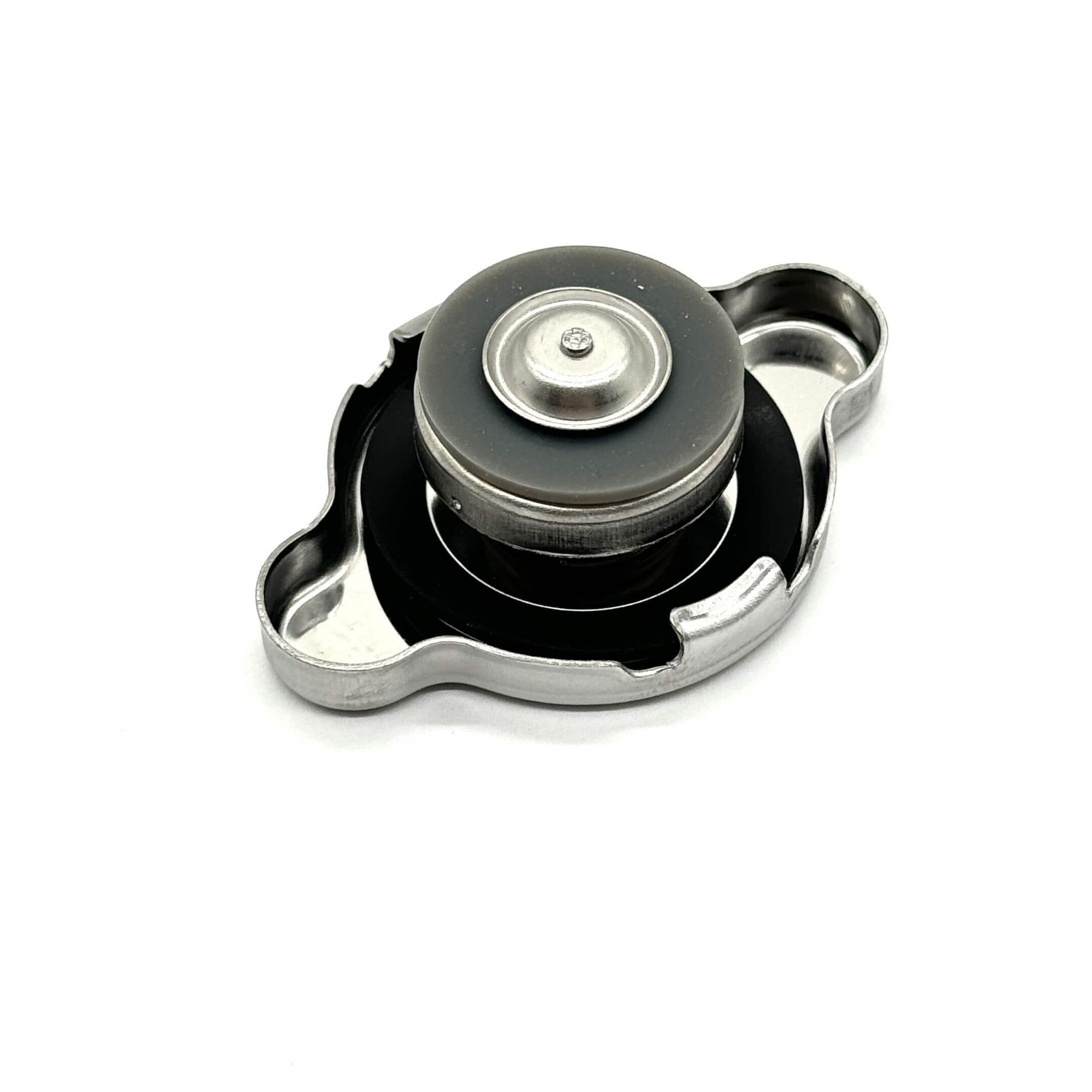 Aftermarket radiator cap for Subaru Sambar Truck TT1, TT2 models (1999-2012), featuring a silver and black design.