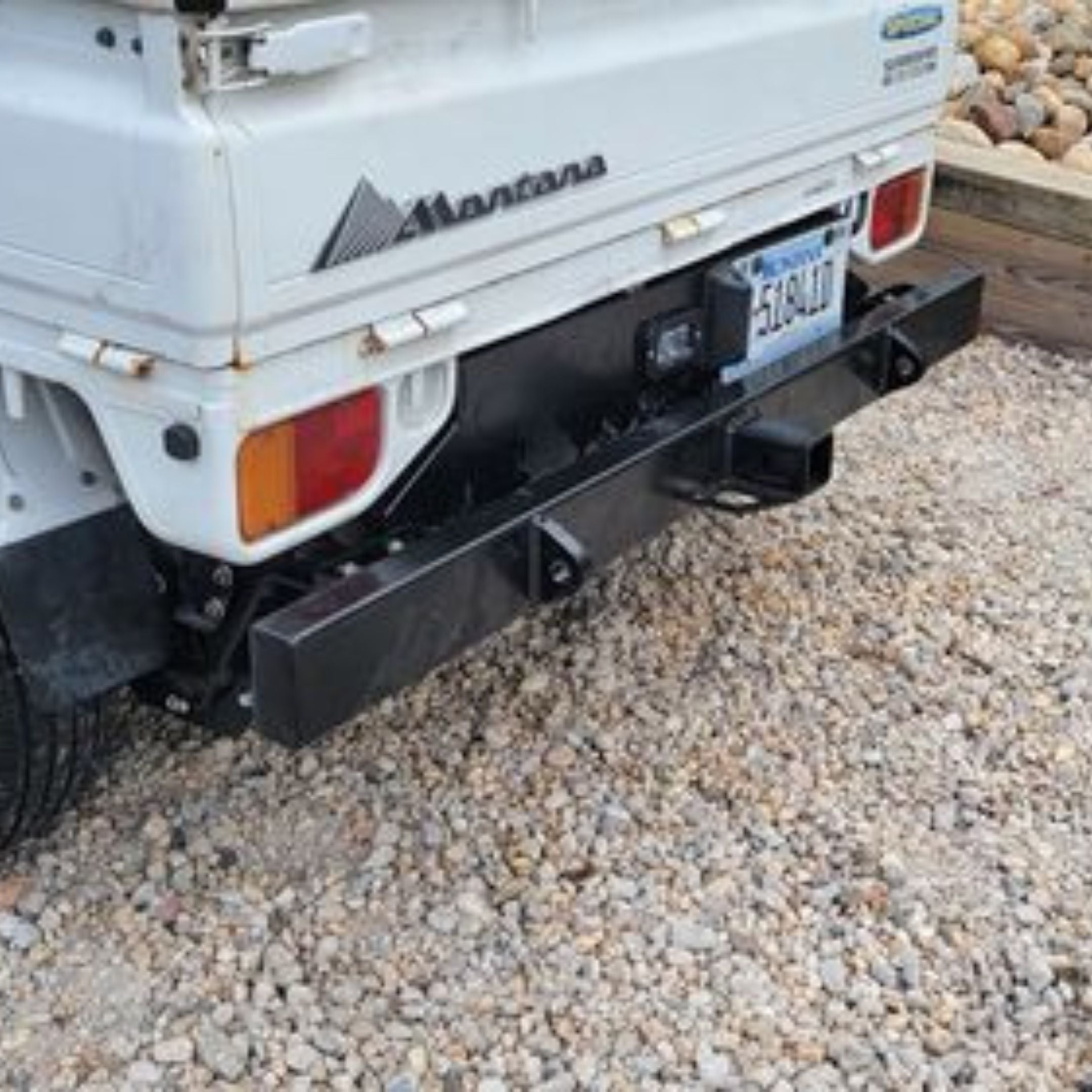 Subaru Sambar TT1, TT2 with black rear tow bumper and engine cover installed, showing license plate relocation and robust construction, 1999-2012 models