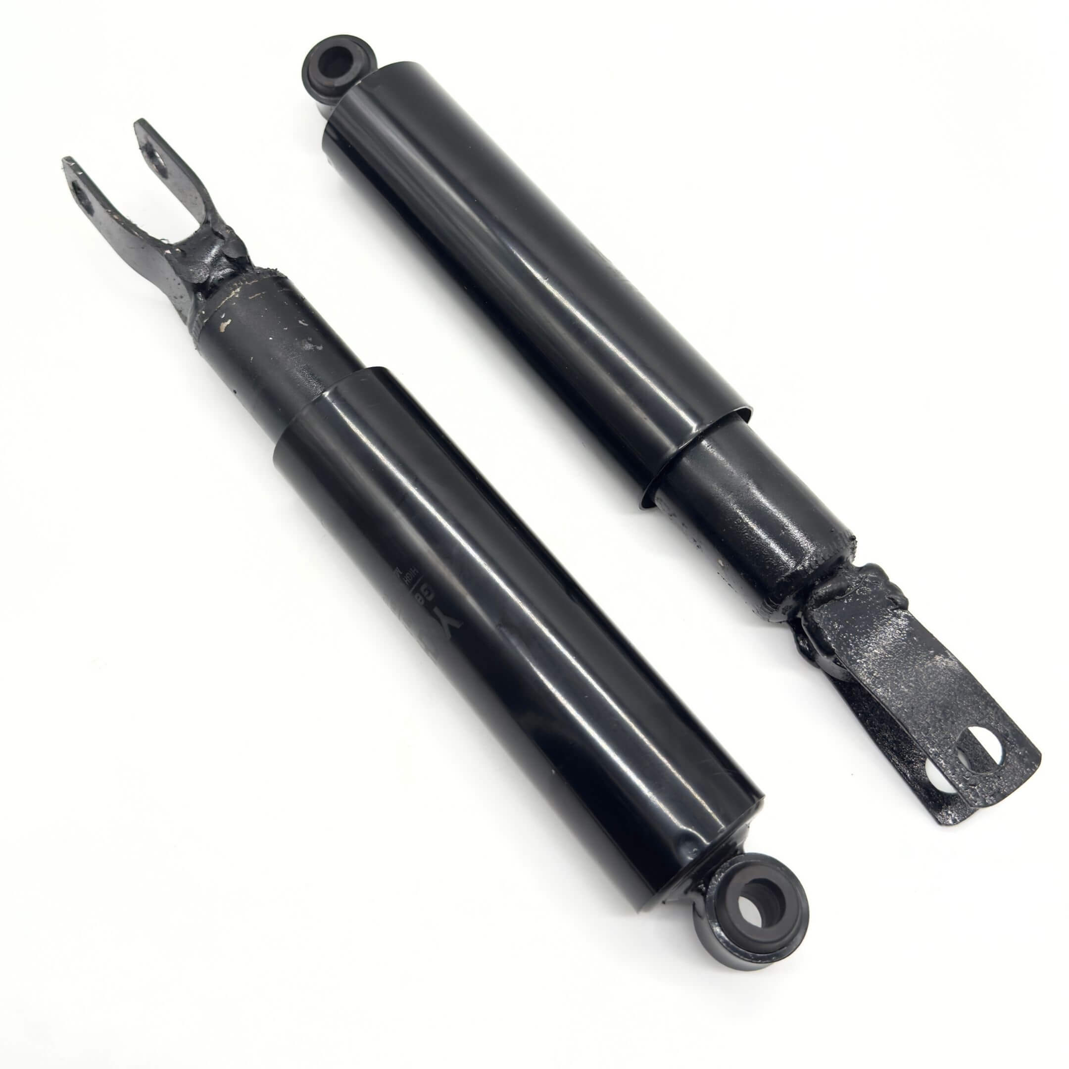 Black rear shocks for Subaru Sambar Van TV1, TV2 models, 1999-2012, featuring durable construction and sleek design.